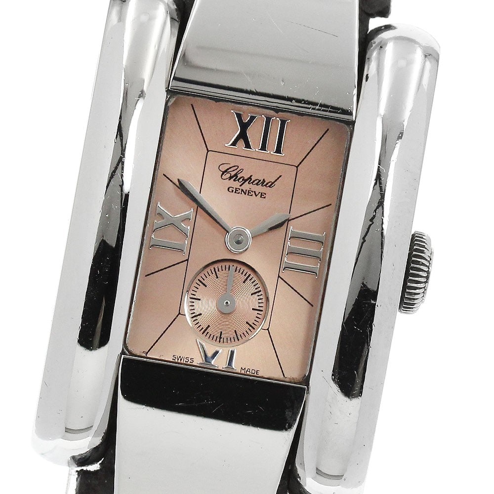 Chopard La Strada Quartz Ladies Watch Small Seconds 8357: Chopard La Strada Quartz Ladies Watch Small Seconds 8357 This Chopard La Strada women's wristwatch features a stainless steel case and an orange dial, complemented by a leather strap. Powered by a qua