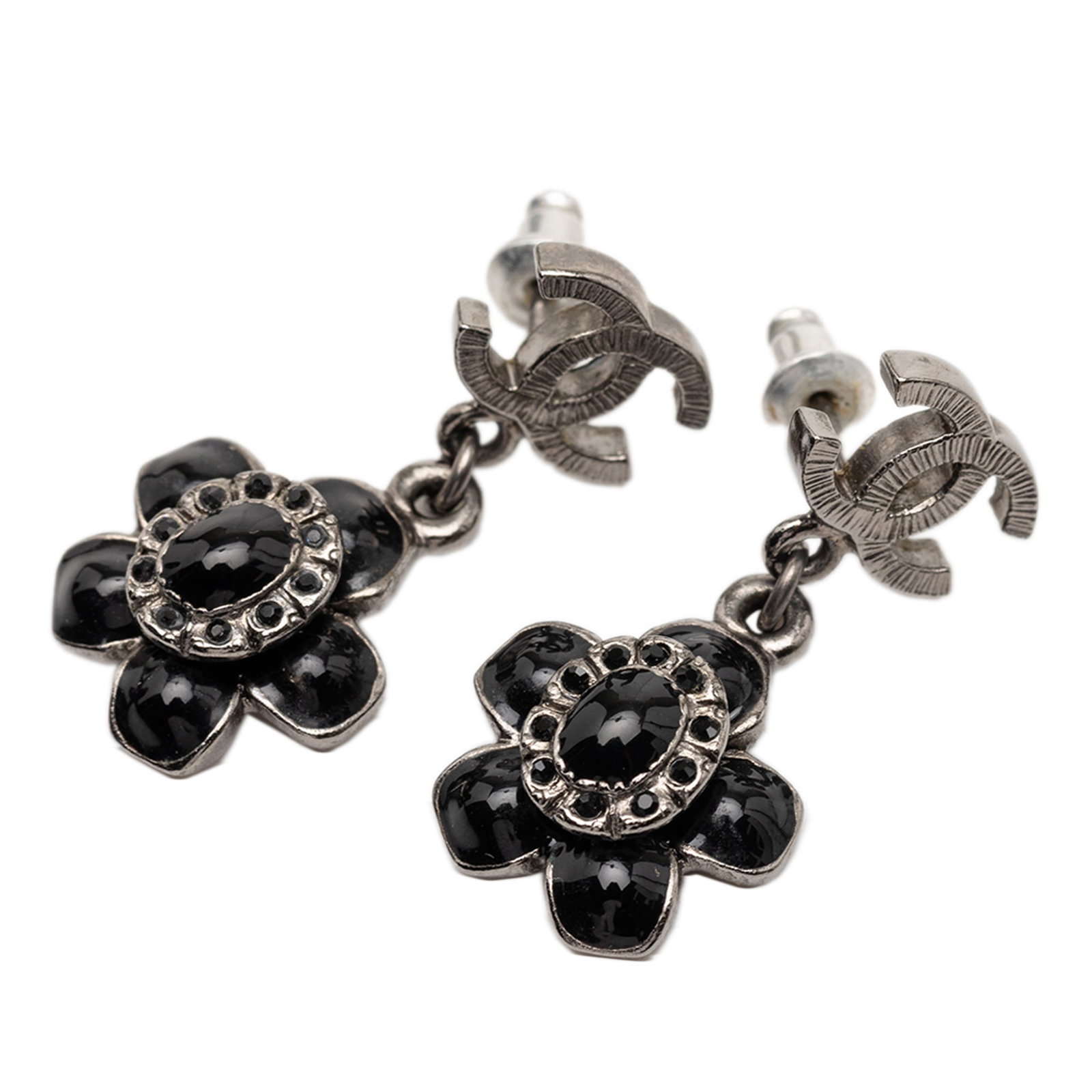 Chanel Enamel Flower Silver Plated Drop Earrings with CC Motif: Chanel Enamel Flower Silver Plated Drop Earrings with CC Motif These Chanel earrings feature silver-plated metal bodies with enamel flower pendants and secure push back closures. Designed as costume j