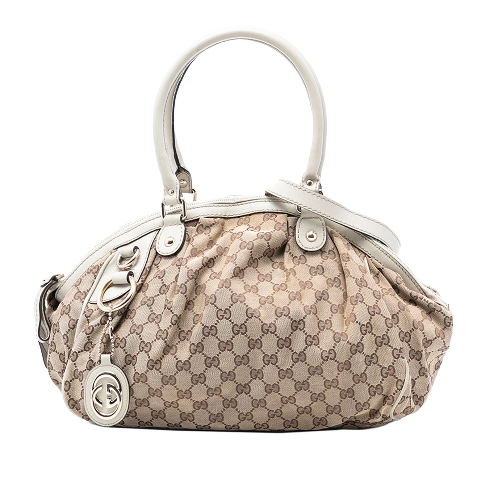 Gucci Sukey Beige Canvas Satchel with Leather Trim and Strap: Gucci Sukey Beige Canvas Satchel with Leather Trim and Strap This Gucci GG Canvas Sukey Satchel features a beige canvas body with leather trim, rolled leather handles, a detachable flat leather strap,