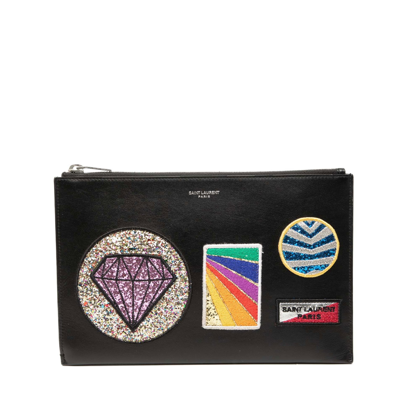 Saint Laurent Multi Patch Leather Clutch Bag with Zip Closure: Saint Laurent Multi Patch Leather Clutch Bag with Zip Closure This Saint Laurent clutch bag features a black leather body adorned with decorative patches. It is designed with a top zip closure and int