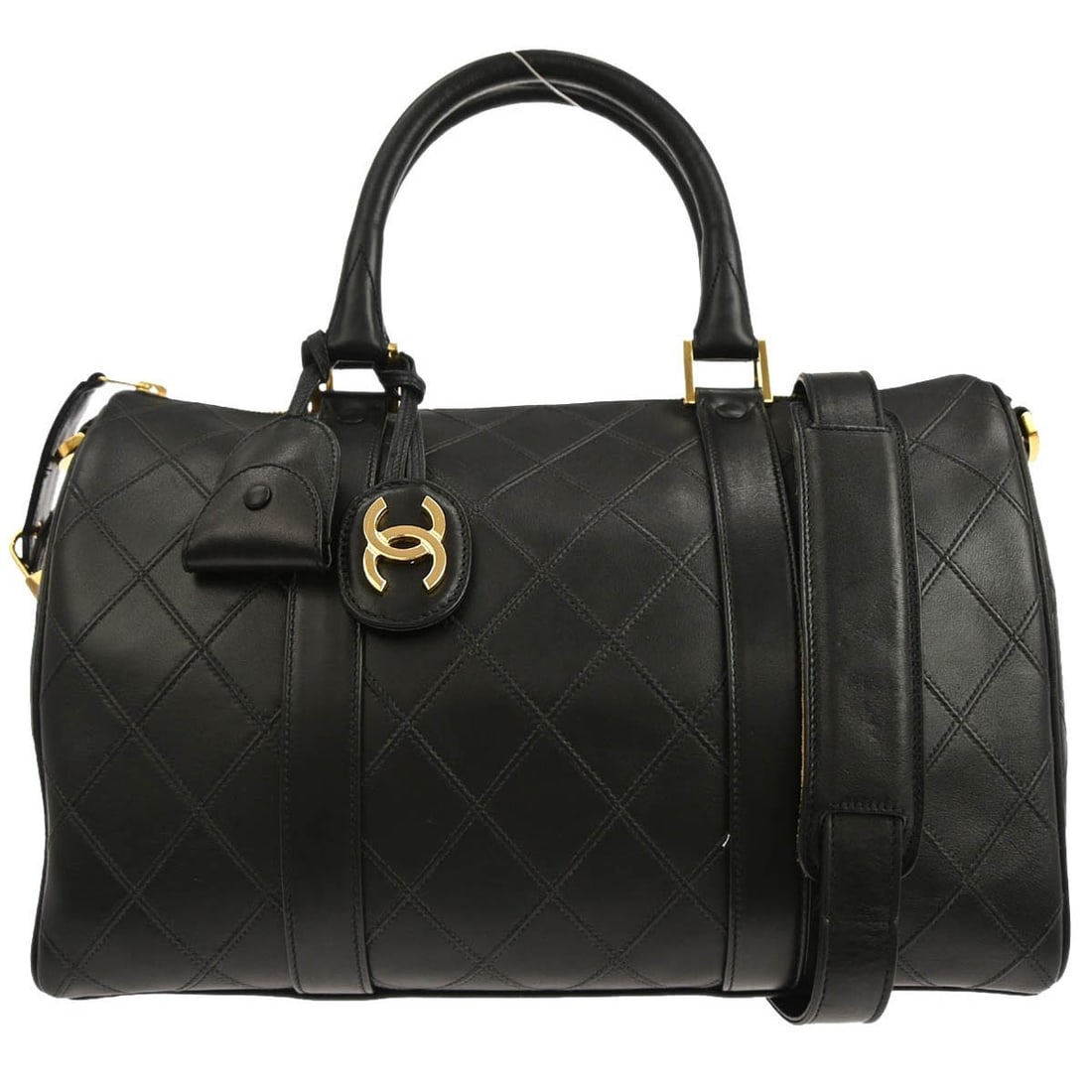 Chanel Duffle Medium Black Leather Two Way Bag with Gold Hardware: Chanel Duffle Medium Black Leather Two Way Bag with Gold Hardware This Chanel duffle handbag features black lambskin leather with a classic bicolore design. It offers both style and versatility with d