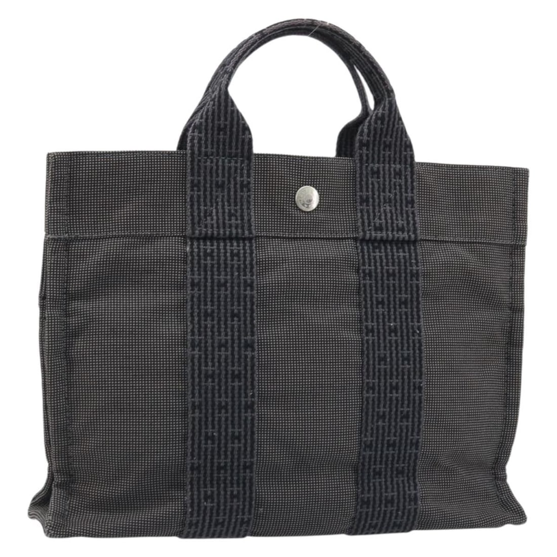 Hermes Her Line PM Gray Canvas Women's Handbag France: Hermes Her Line PM Gray Canvas Women's Handbag France This Hermes Her Line PM handbag features a gray canvas exterior with a classic and minimalist design. Crafted in France, it is designed for women 
