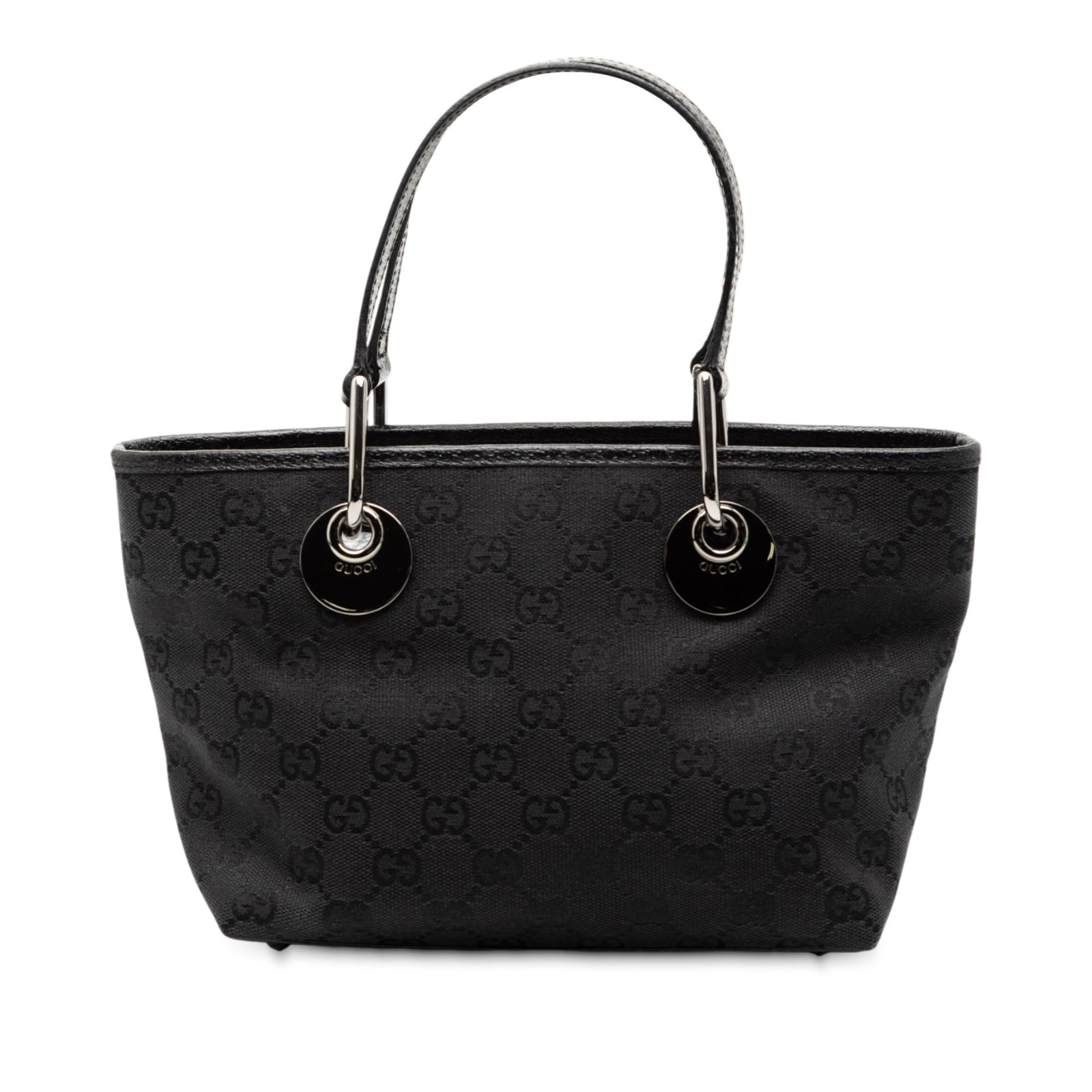 Black GG Canvas Eclipse Tote with Leather Trim by Gucci: Black GG Canvas Eclipse Tote with Leather Trim by Gucci This Gucci GG Canvas Eclipse Handbag features a distinctive canvas body with leather trim, complemented by flat leather straps and silver-tone h
