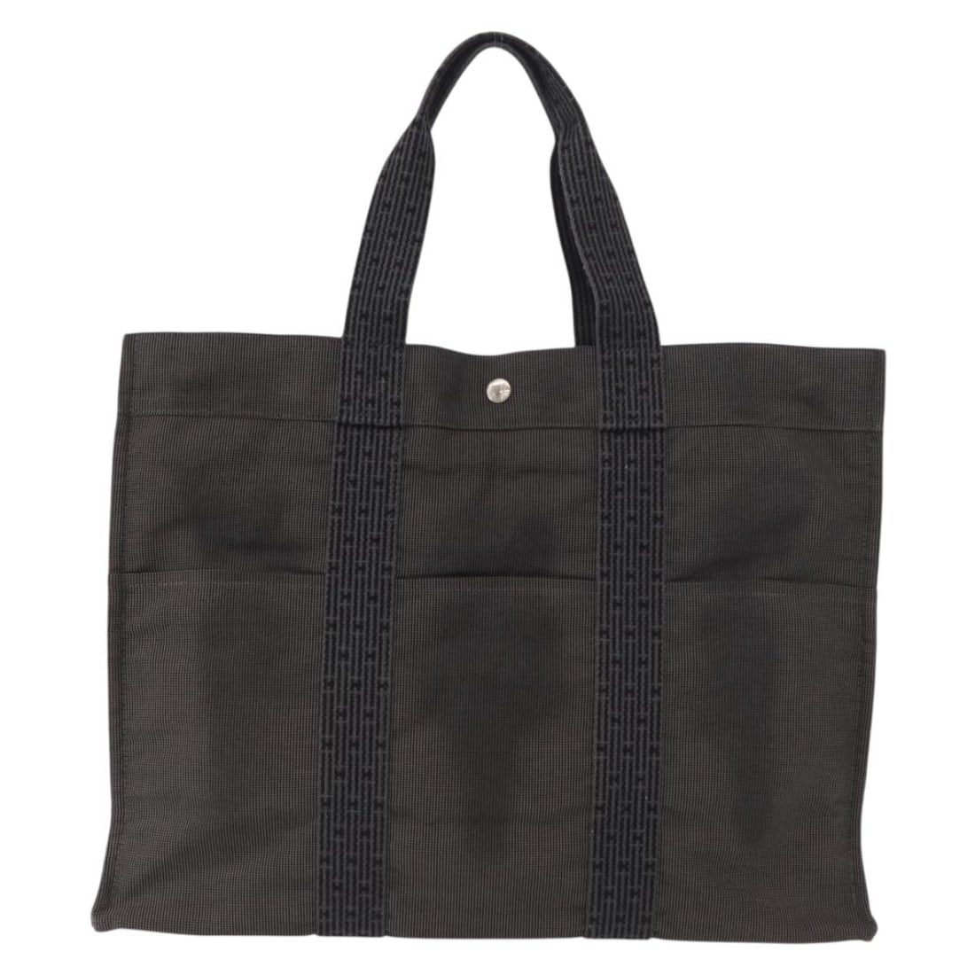 Gray Canvas Hermes Herline Tote Bag 46cm by 35cm by 15cm: Gray Canvas Hermes Herline Tote Bag 46cm by 35cm by 15cm Hermes Fourre-tout Herline tote bag in gray canvas designed for women. This spacious bag features a practical design with an exterior and inter
