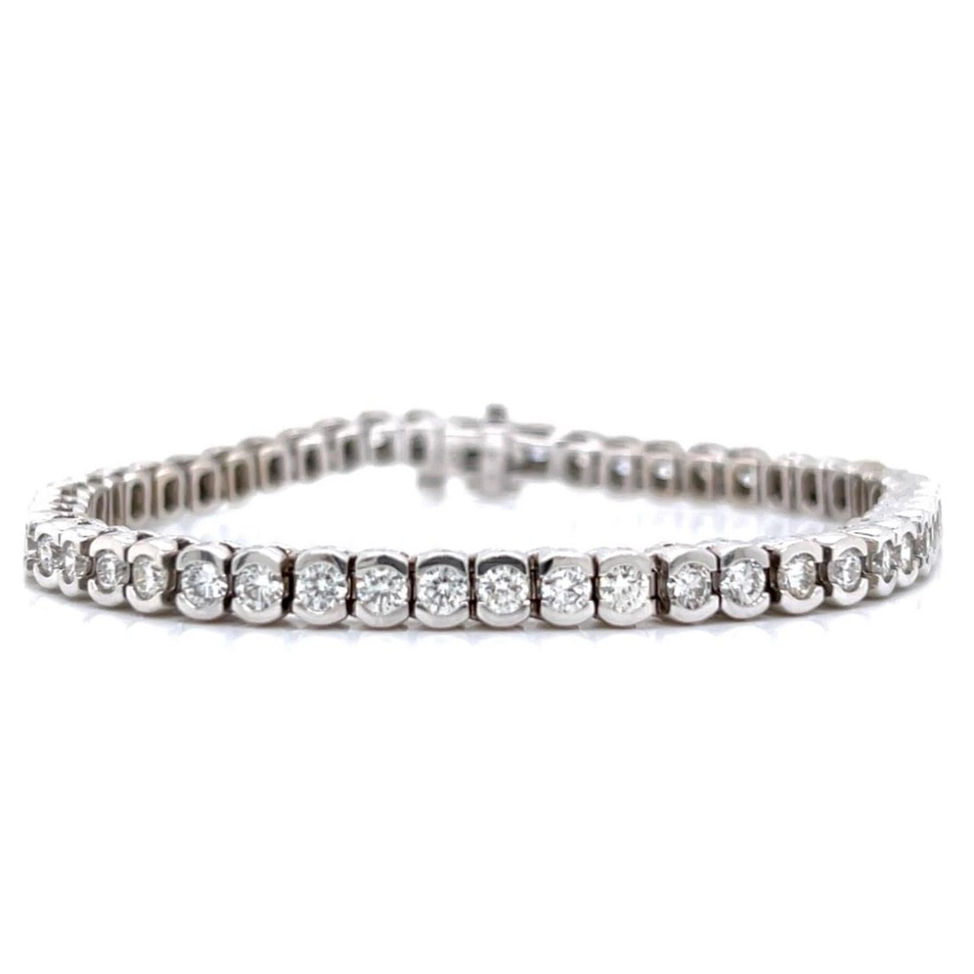 14K White Gold 6.00 Ct Diamond Tennis Bracelet 7 Inches: 14K White Gold 6.00 Ct Diamond Tennis Bracelet 7 Inches This stunning 14K white gold tennis bracelet showcases a remarkable collection of 51 diamonds, totaling approximately 6.00 carats. The diamonds 