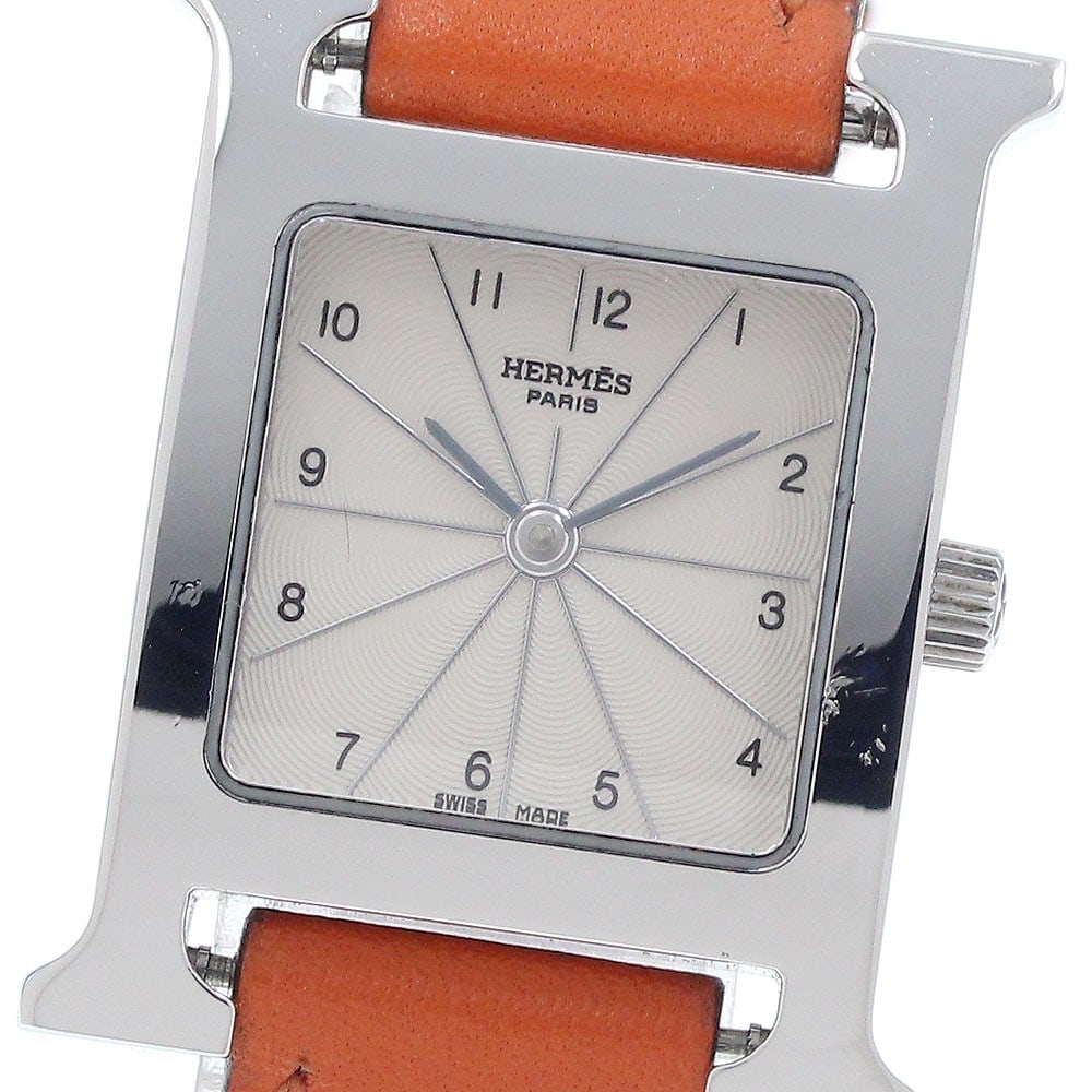 Hermes H-Watch Quartz Beige Dial Stainless Steel Ladies Wristwatch: Hermes H-Watch Quartz Beige Dial Stainless Steel Ladies Wristwatch This pre-owned HERMES H-Watch HH1.210 is a stylish women's wristwatch featuring a stainless steel case and a beige dial. It operates 