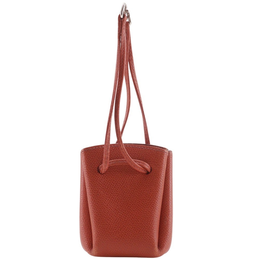Orange Leather Vespa Pouch by Hermes for Women: Orange Leather Vespa Pouch by Hermes for Women This Hermes Vespa Pouch is crafted from orange leather and designed for women. The pouch features minor stains and scratches on both the exterior and int