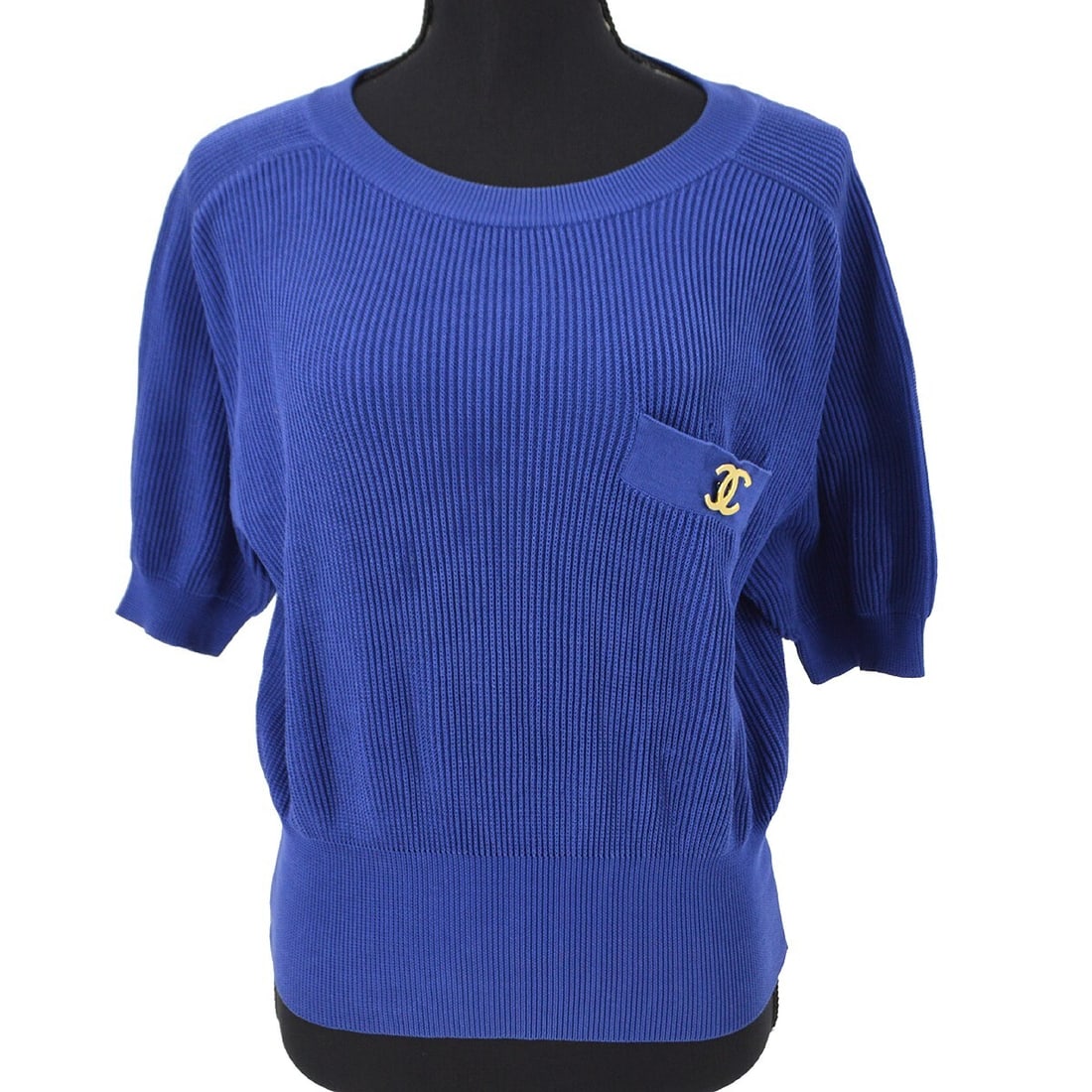 Chanel Vintage Blue Knit T-Shirt #40 Short Sleeve Round Neck: Chanel Vintage Blue Knit T-Shirt #40 Short Sleeve Round Neck Elevate your casual wardrobe with this vintage Chanel #40 T-Shirt. This stylish top features a round neckline and short sleeves, making it 
