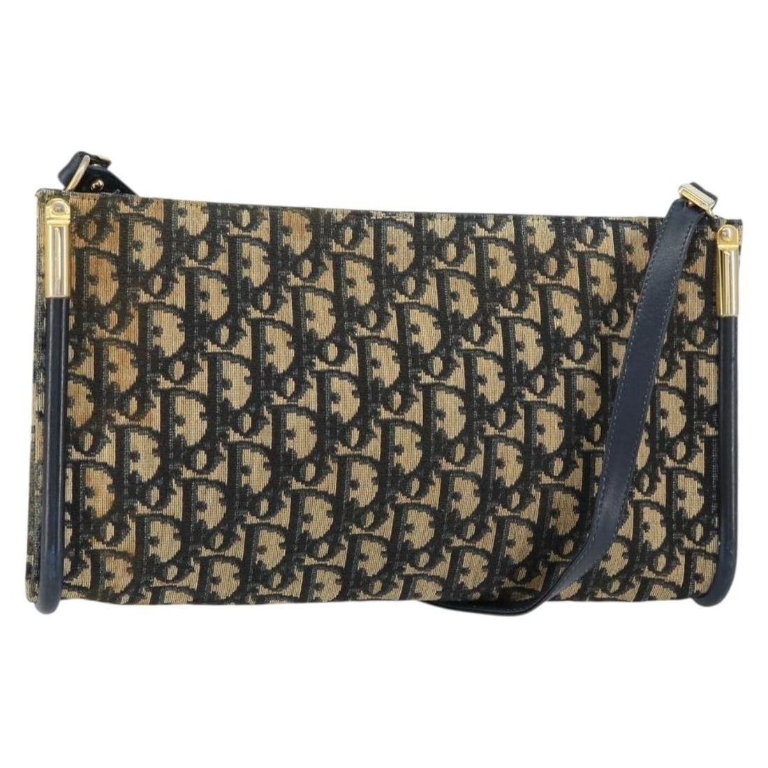 Christian Dior Canvas Navy Shoulder Bag Vintage Trotter 29cm: Christian Dior Canvas Navy Shoulder Bag Vintage Trotter 29cm This Christian Dior Vintage Trotter shoulder bag for women features a navy canvas exterior with metal fittings. The bag has a shoulder stra