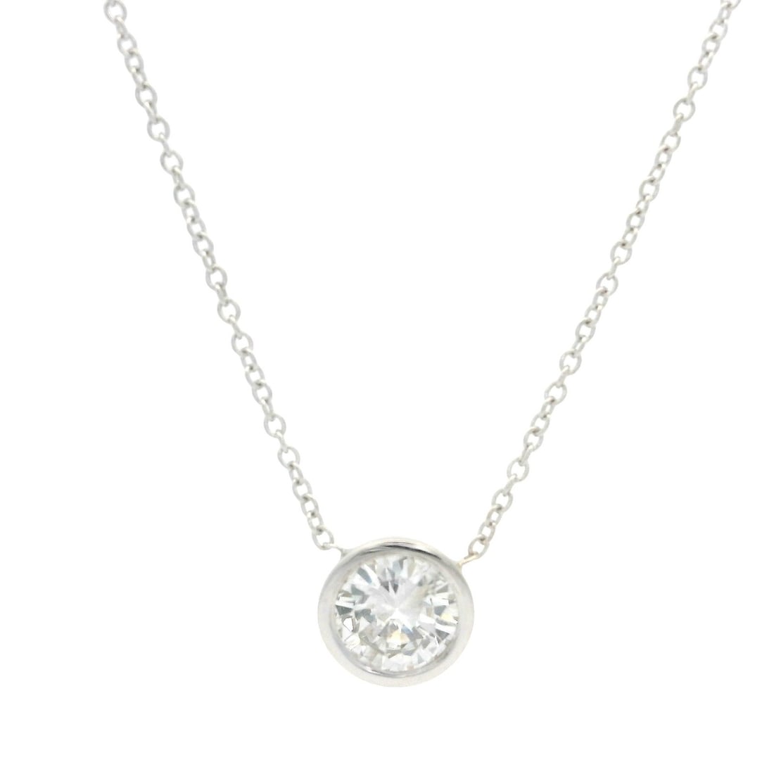 14k White Gold 0.60ct Diamond Solitaire Pendant Necklace: 14k White Gold 0.60ct Diamond Solitaire Pendant Necklace This exquisite pendant necklace features a stunning natural diamond set in a sleek bezel design. The round brilliant cut diamond weighs 0.60 ca