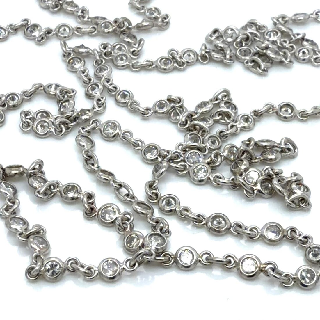 29 Inch Platinum Necklace with 5.00 Carat Diamonds by the Yard: 29 Inch Platinum Necklace with 5.00 Carat Diamonds by the Yard This platinum necklace features approximately 5.00 carats of diamonds in a 'diamond by the yard' design. The diamonds are G-H color with 