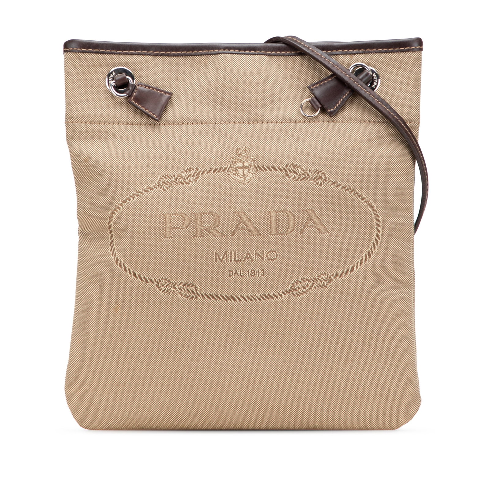 Prada Canvas Canapa Logo Crossbody Bag Brown Italy: Prada Canvas Canapa Logo Crossbody Bag Brown Italy This Prada Canvas Canapa Logo Crossbody bag is a stylish accessory featuring a canvas body complemented by leather trim. It has a flat adjustable str