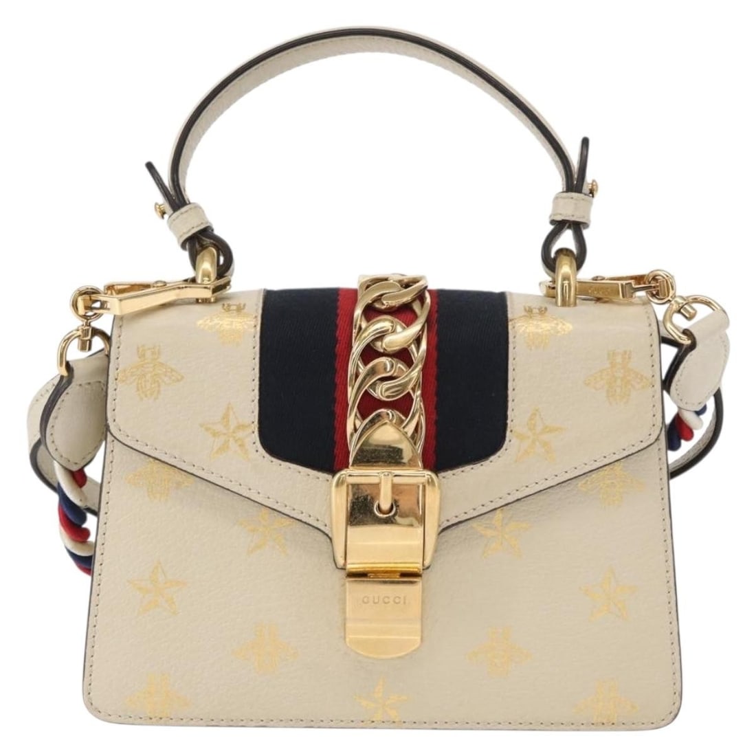 Beige Printed Leather Gucci Sylvie Handbag With Replacement Strap: Beige Printed Leather Gucci Sylvie Handbag With Replacement Strap The Gucci Sylvie Top Handle Bag is crafted from printed beige leather and features a structured silhouette. Designed for women, this p