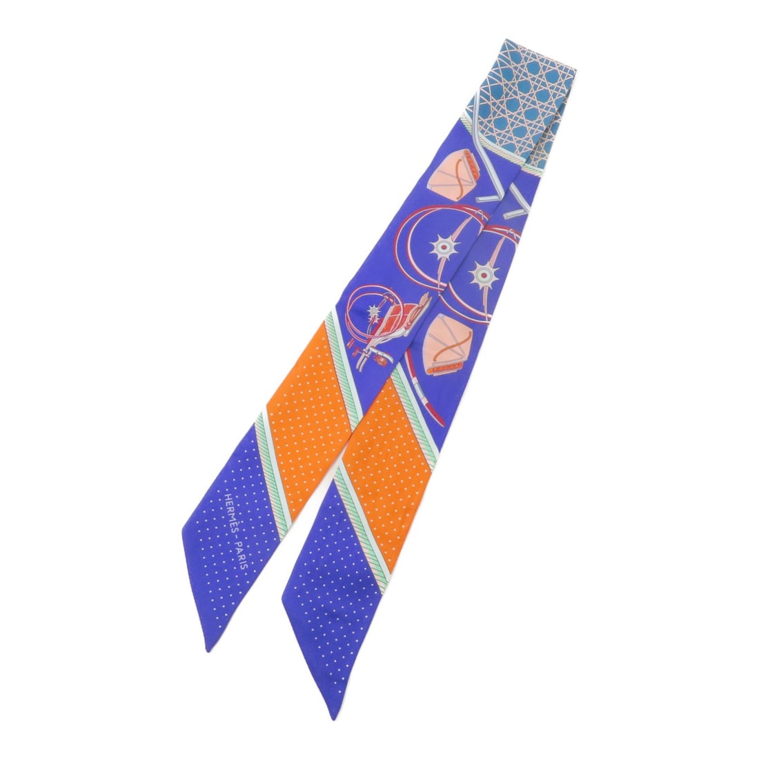 Hermes Twilly silk scarf blue orange: Hermes Twilly silk scarf blue orange This Hermes Twilly scarf is crafted from silk and features a blue and orange color palette. Designed for women, it offers a stylish accent to any ensemble. Made in