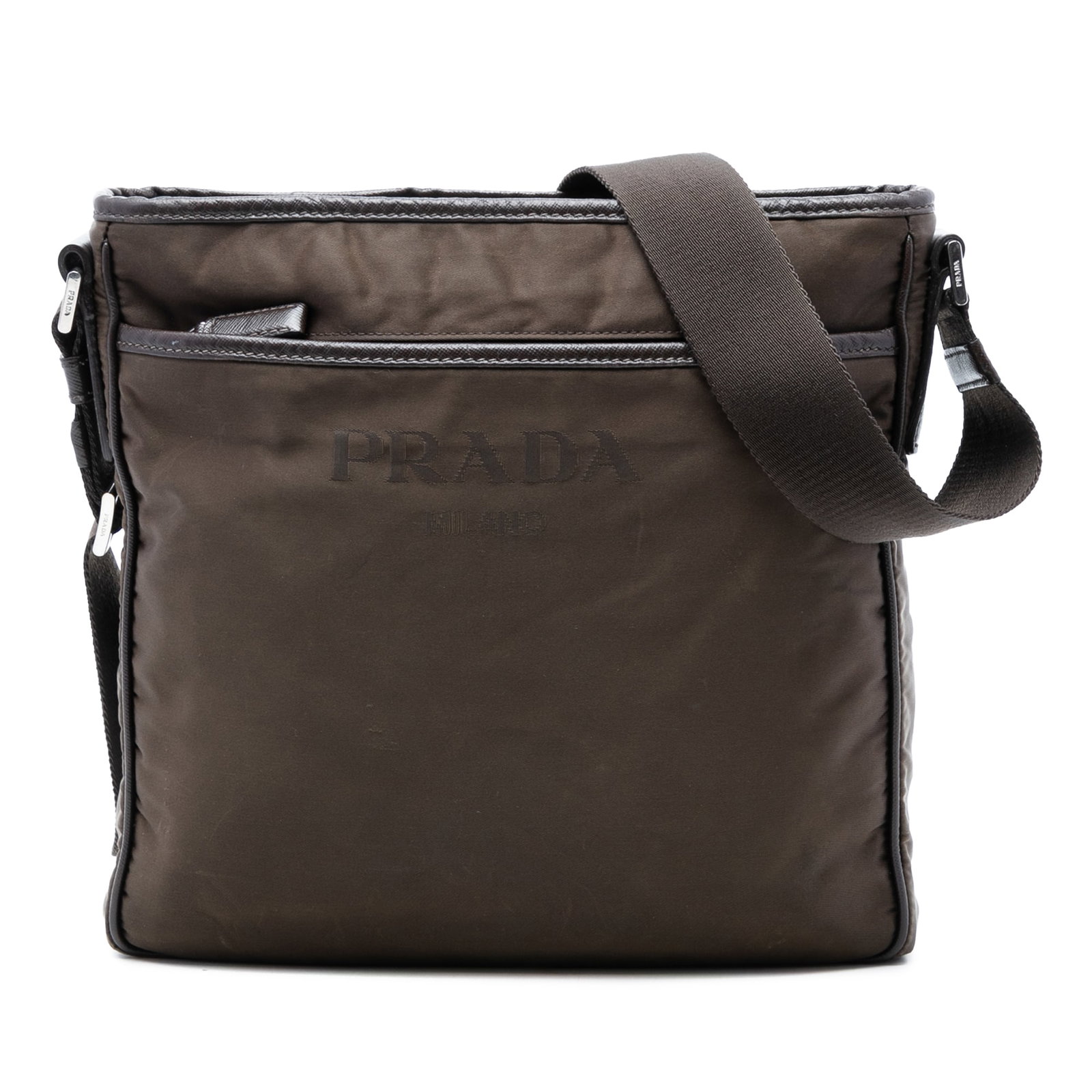 Prada Tessuto Nylon Crossbody Bag with Leather Trim and Zip Closures: Prada Tessuto Nylon Crossbody Bag with Leather Trim and Zip Closures This Prada Tessuto Zip Top Crossbody bag is crafted from durable nylon with leather trim and features an adjustable flat strap, a s