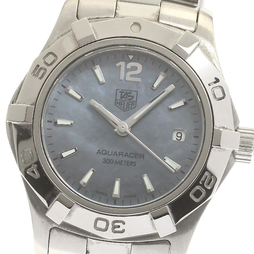 TAG Heuer Aquaracer Quartz Date Womens Stainless Steel Watch WAF1417: TAG Heuer Aquaracer Quartz Date Womens Stainless Steel Watch WAF1417 This TAG HEUER Aquaracer WAF1417 is a women's wristwatch featuring a stainless steel case and bracelet with a blue shell dial. The 