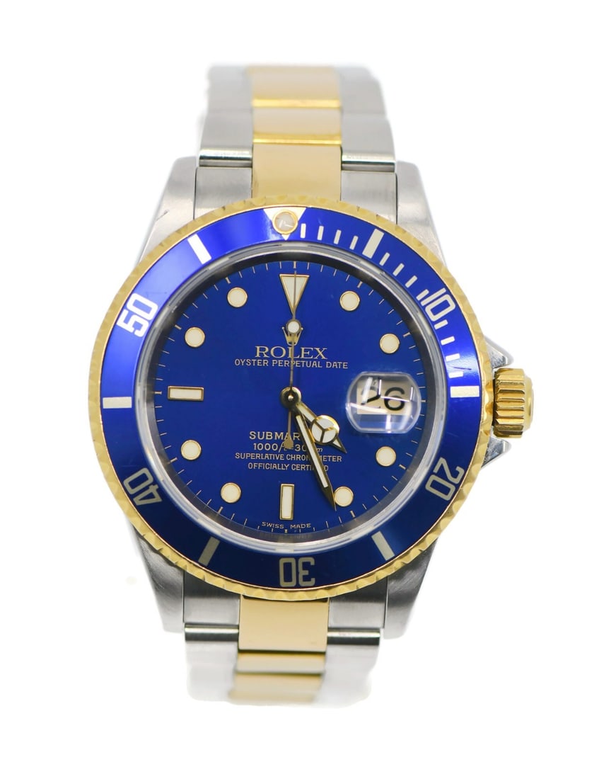 Submariner Ref 16613 Blue Dial Automatic 18K and Steel Rolex Wristwatch with Box: Submariner Ref 16613 Blue Dial Automatic 18K and Steel Rolex Wristwatch with Box This Rolex Submariner wristwatch features a 40mm stainless steel case with 18K accents and a blue analog dial. The watc