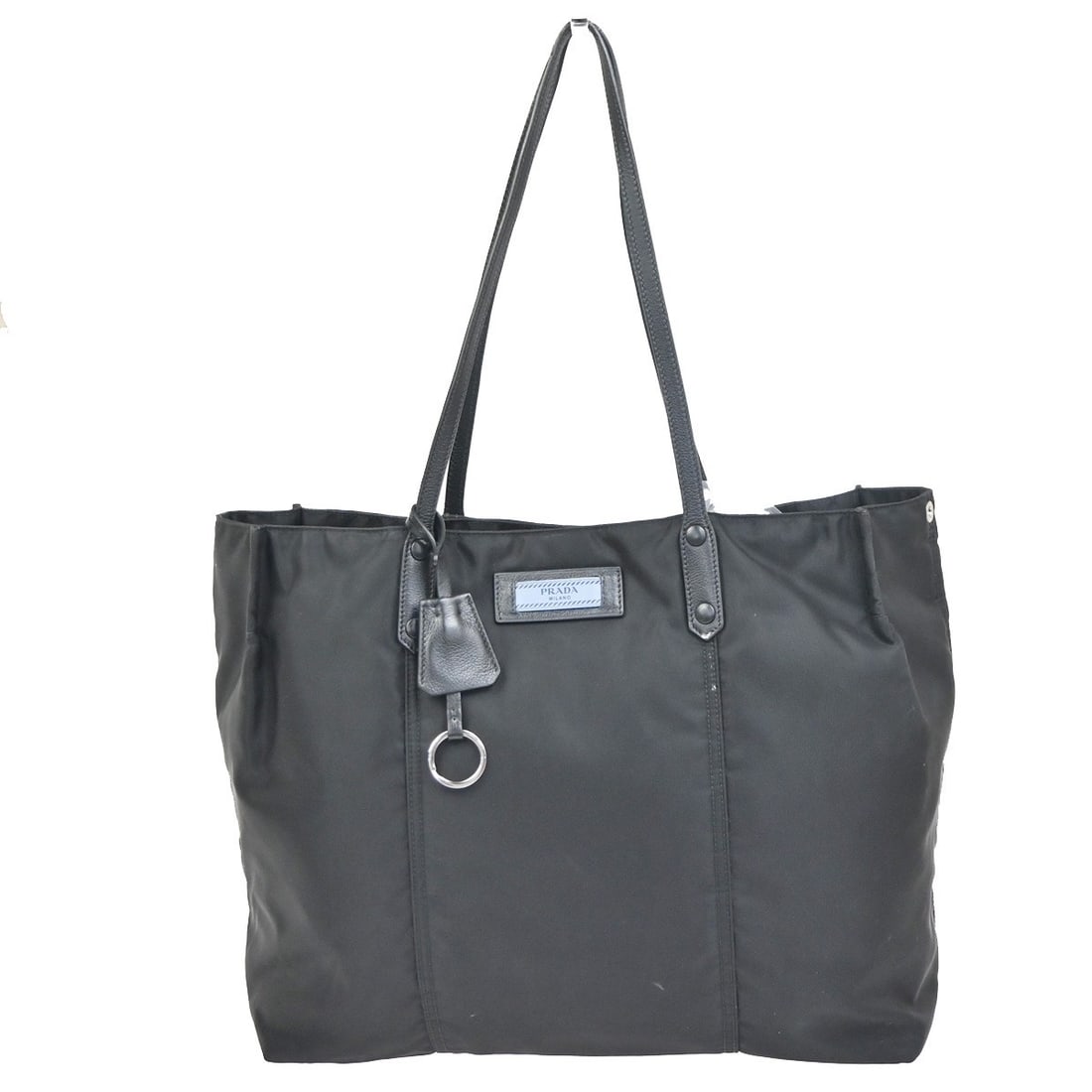 Black Nylon Prada Etiquette Tote Bag for Women: Black Nylon Prada Etiquette Tote Bag for Women The Prada Etiquette Tote is a stylish women's bag crafted from black nylon. Featuring a spacious interior and durable construction, this tote is designed
