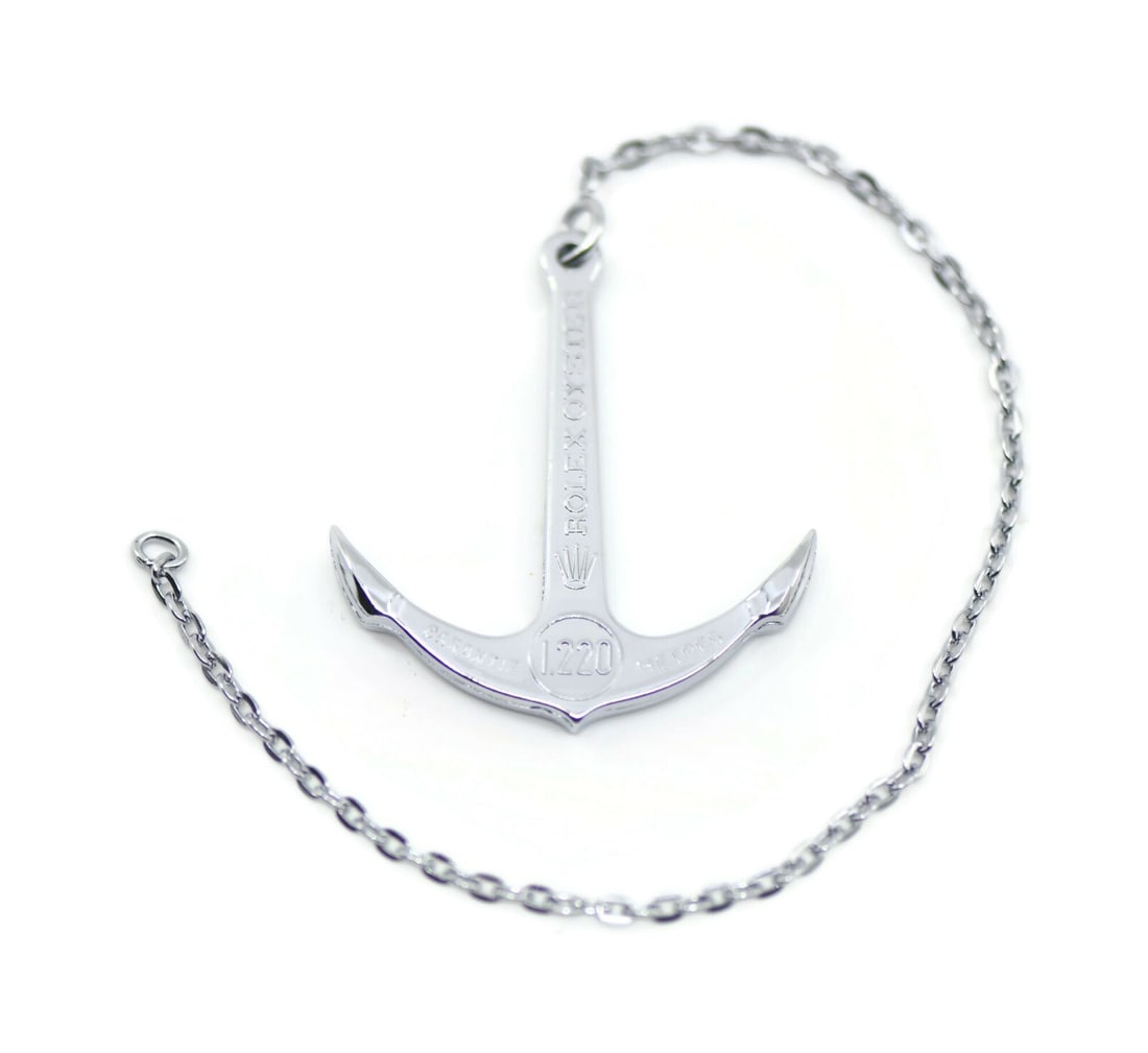 Oyster Model 1220M 4000F Anchor by Rolex Switzerland: Oyster Model 1220M 4000F Anchor by Rolex Switzerland This is a pre-owned Rolex Oyster 1220M/4000F anchor, a collectible accessory associated with the Rolex brand. Manufactured in Switzerland, it serve