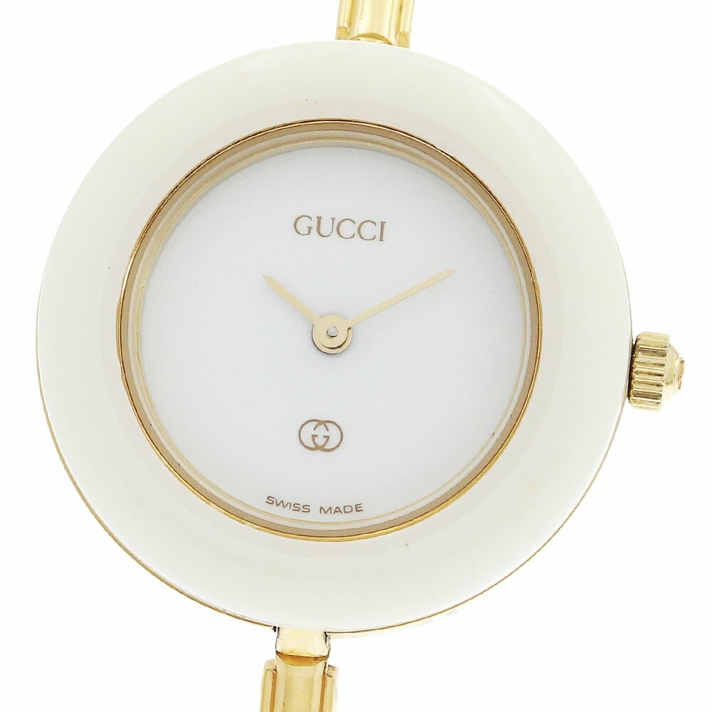 Gucci Change Bezel 1100-L Quartz Womens Wristwatch with 11 Bezels: Gucci Change Bezel 1100-L Quartz Womens Wristwatch with 11 Bezels This pre-owned GUCCI 1100-L Changeable Bezel Quartz women's watch features a stainless steel and gold-plated case and bracelet, comple