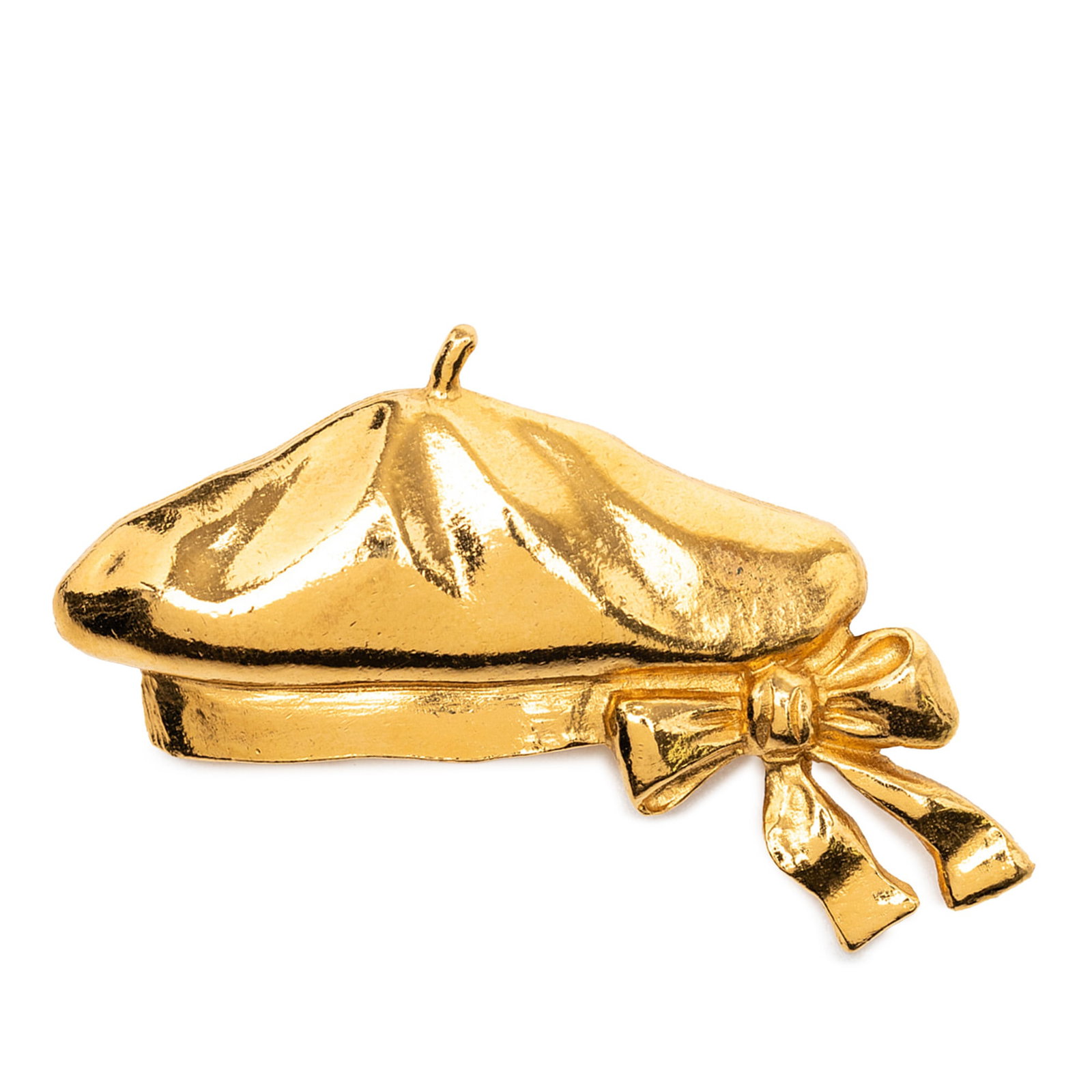 Chanel Metal Brooch with Gold Tone Beret Hat Design: Chanel Metal Brooch with Gold Tone Beret Hat Design This Chanel brooch is crafted from gold tone metal and designed in the shape of a beret hat. It features a back pin closure for secure attachment. T