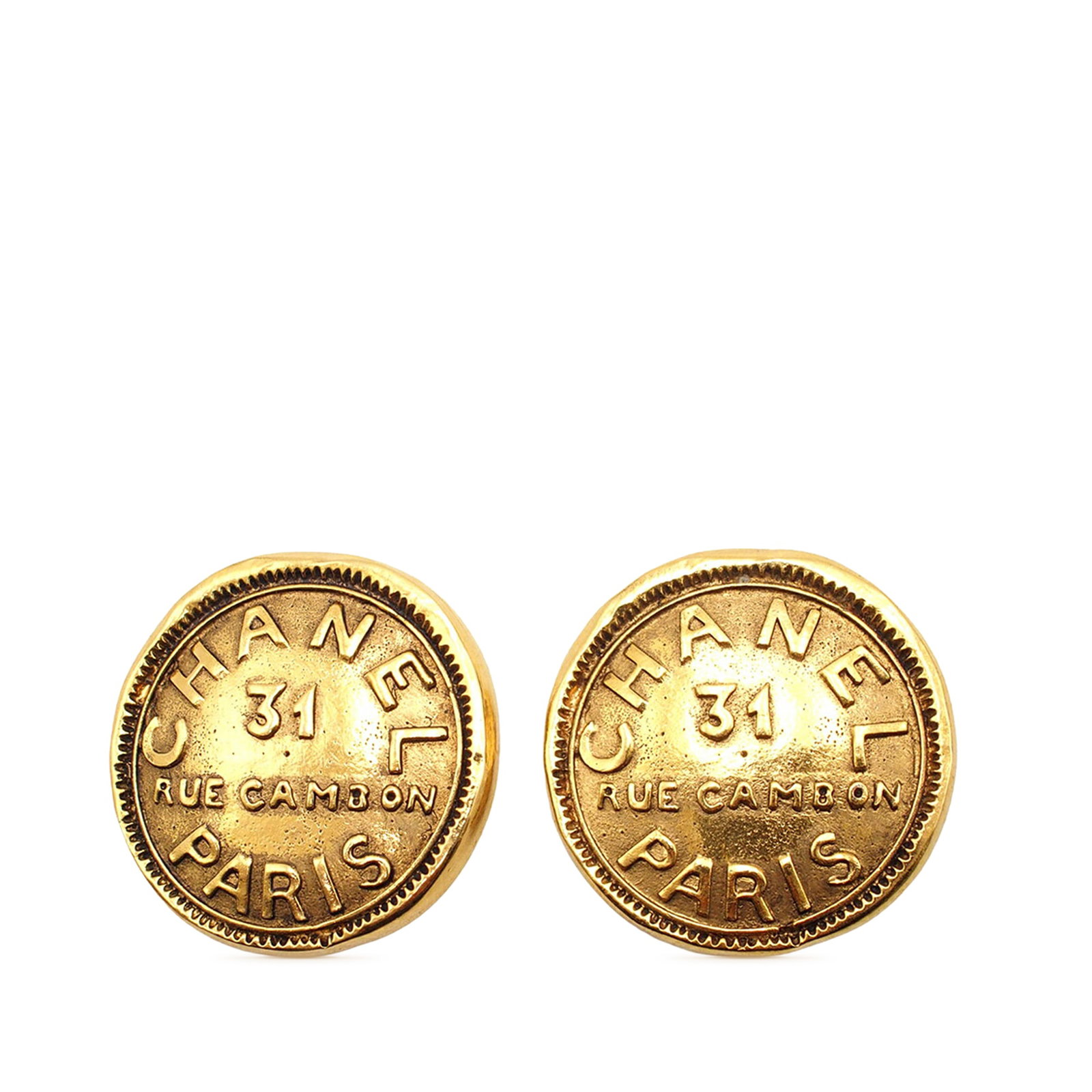 Chanel 31 Rue Cambon Round Clip Earrings in Gold Tone Metal: Chanel 31 Rue Cambon Round Clip Earrings in Gold Tone Metal These Chanel round clip-on earrings feature gold tone metal bodies with back clip-on closures. Made in France, they are designed as part of 