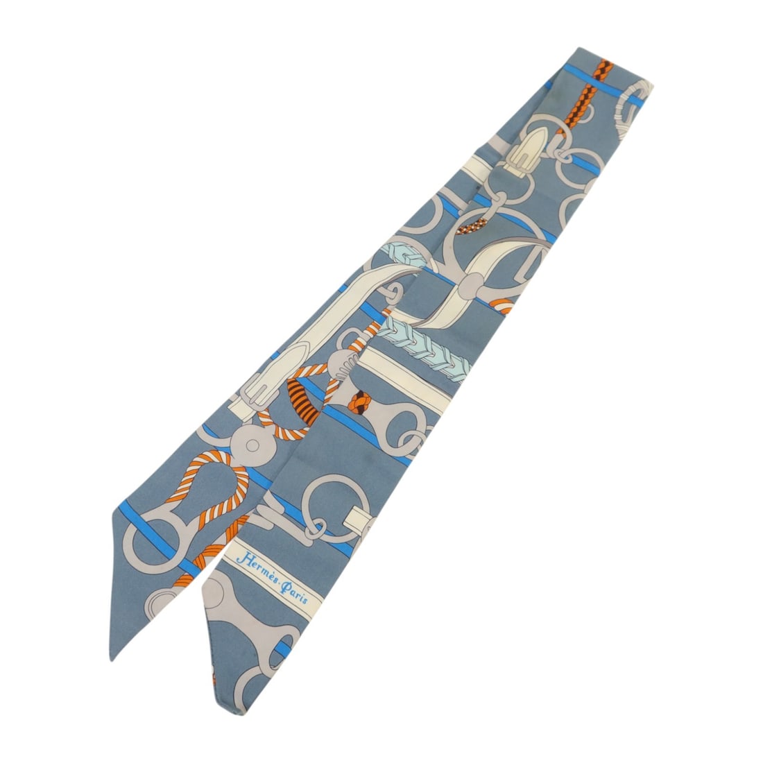 Hermes Silk Twilly Blue and Multicolor Women's Scarf: Hermes Silk Twilly Blue and Multicolor Women's Scarf Hermes Twilly scarf crafted from silk, featuring a blue, grey, orange, and multicolor design. This stylish accessory is designed for women and offe