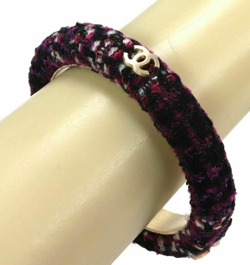 Chanel Tweed Fabric Bangle Bracelet Purple Black Gold Tone: Chanel Tweed Fabric Bangle Bracelet Purple Black Gold Tone This Chanel bangle bracelet from the Tweed collection features a dome design crafted from a blend of dark and light purple with black fabric.