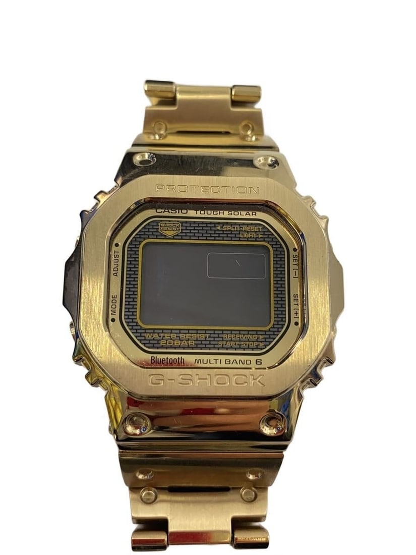 CASIO GMW-B5000GD-9JF Gold Stainless Steel Solar Bluetooth Wristwatch: CASIO GMW-B5000GD-9JF Gold Stainless Steel Solar Bluetooth Wristwatch This Casio G-SHOCK GMW-B5000GD-9JF is a full metal wristwatch featuring a gold-tone stainless steel case and band. Designed for me