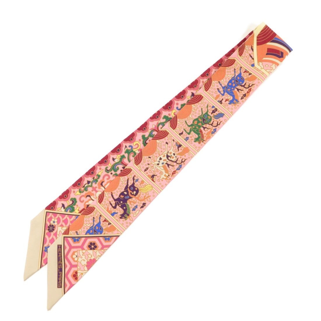 Hermes Twilly Silk Pink Beige Fashion Scarf: Hermes Twilly Silk Pink Beige Fashion Scarf This Hermes Twilly scarf is crafted from luxurious silk and features a pink and beige color palette. Designed for women, this elegant accessory showcases th