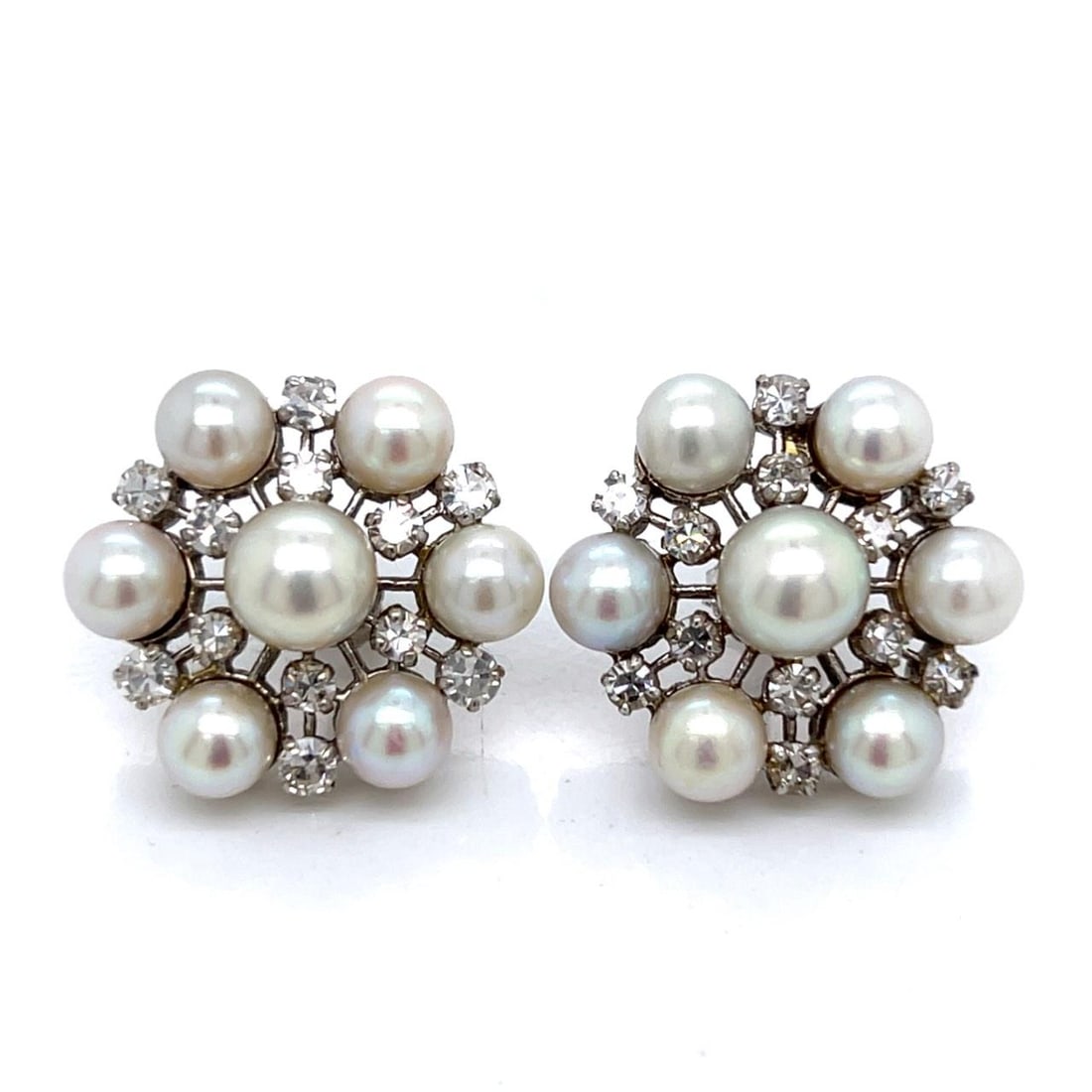1960s 14K White Gold Pearl Diamond Earrings 24 Stones 1.20 Ct: 1960s 14K White Gold Pearl Diamond Earrings 24 Stones 1.20 Ct These exquisite 1960's earrings are crafted from 14K white gold and feature a stunning combination of pearls and diamonds. Weighing 9.4 gr
