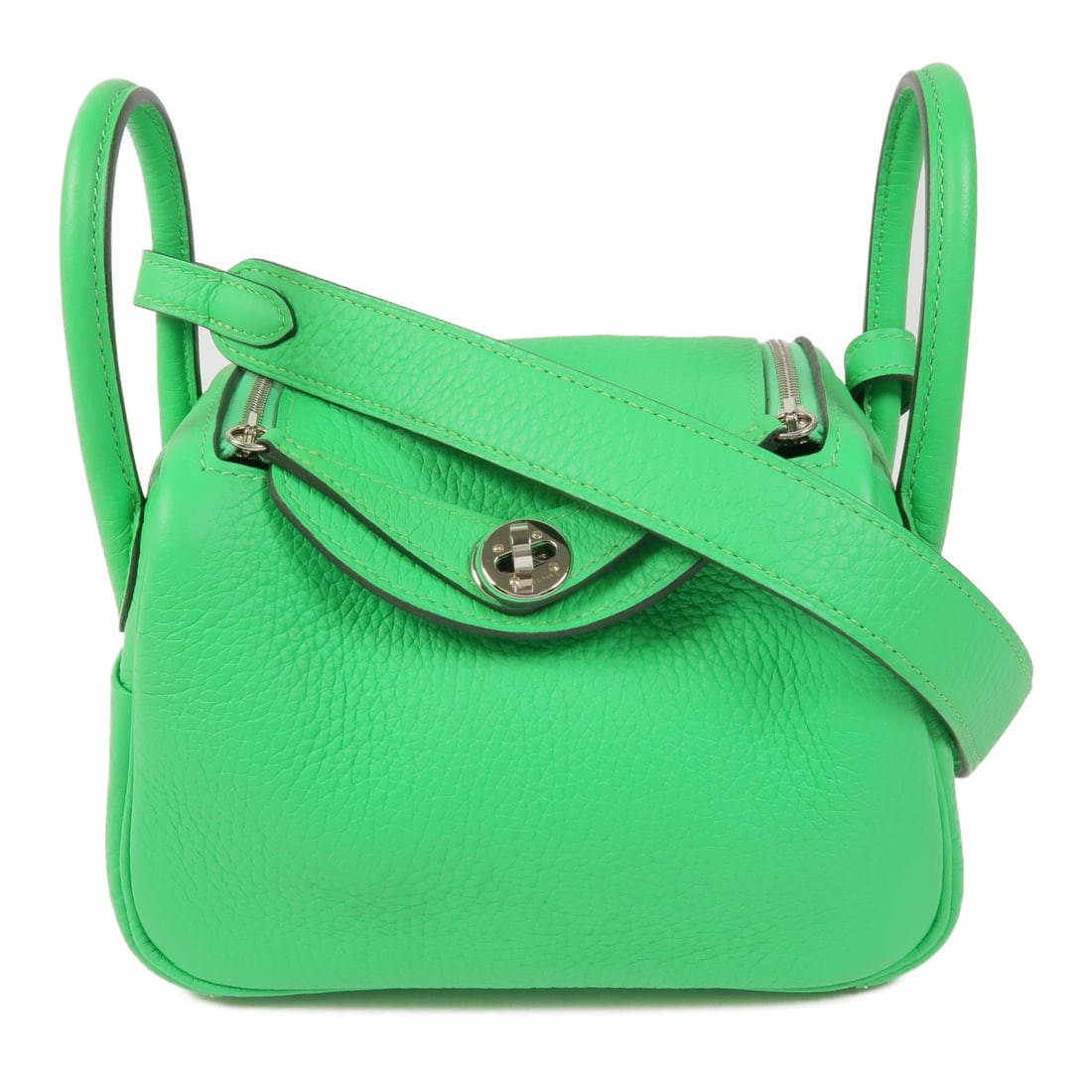 HERMES Mini Lindy 2 Way Shoulder Bag Clemence Leather Green: HERMES Mini Lindy 2 Way Shoulder Bag Clemence Leather Green This HERMES Mini Lindy 2 Way Shoulder Bag is crafted from high-quality calfskin leather, showcasing a stylish green exterior. With its versa