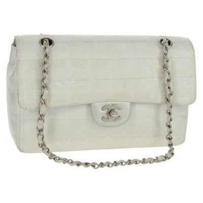 CHANEL Travel Line Choco Bar 25 Silver Nylon Shoulder Bag: CHANEL Travel Line Choco Bar 25 Silver Nylon Shoulder Bag This CHANEL Travel Line Choco Bar 25 Chain Bag features a stylish silver nylon exterior with the iconic CC logo and a practical chain shoulder