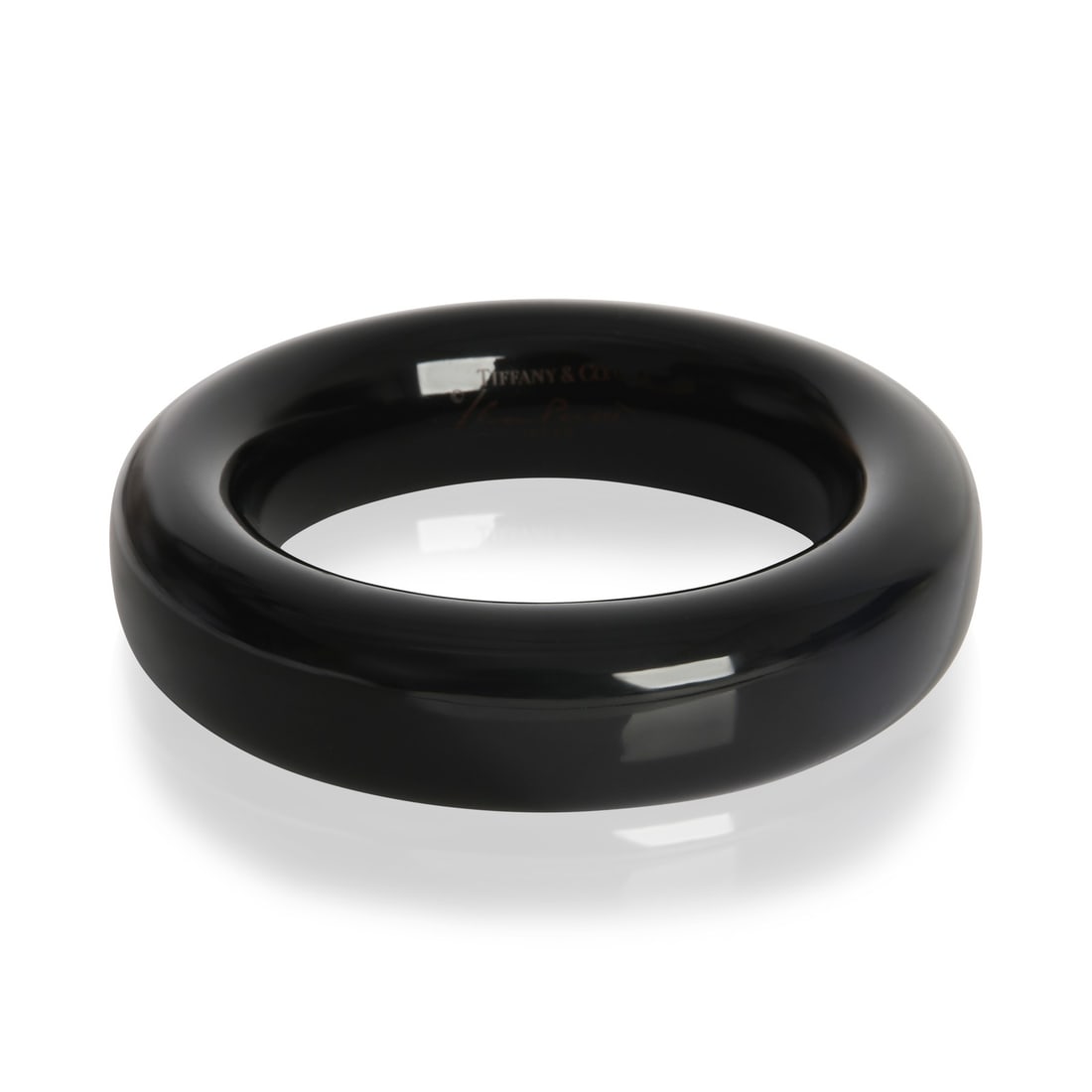 Elsa Peretti Black Lacquer 7 Inch Bracelet by Tiffany & Co.: Elsa Peretti Black Lacquer 7 Inch Bracelet by Tiffany & Co. This Tiffany & Co. Elsa Peretti Black Lacquer Bracelet is a stylish accessory crafted for women. Designed without stones or a clasp, it show