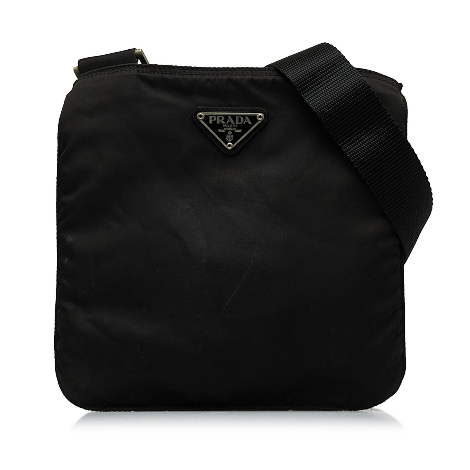 Black Tessuto Nylon Crossbody Bag by Prada with Adjustable Strap: Black Tessuto Nylon Crossbody Bag by Prada with Adjustable Strap This Prada Tessuto Zip Top Crossbody bag is crafted from black nylon fabric and features an adjustable flat strap, a top zip closure, a