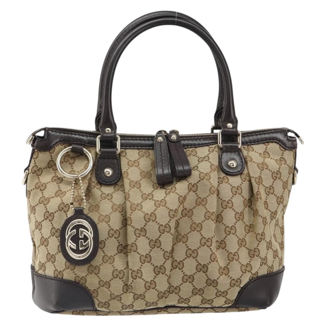 Gucci Sukey Beige GG Canvas Satchel with Leather Trim: Gucci Sukey Beige GG Canvas Satchel with Leather Trim The Gucci Sukey Top Handle Satchel features signature GG canvas complemented by leather accents in beige. Designed for women, this satchel offers 
