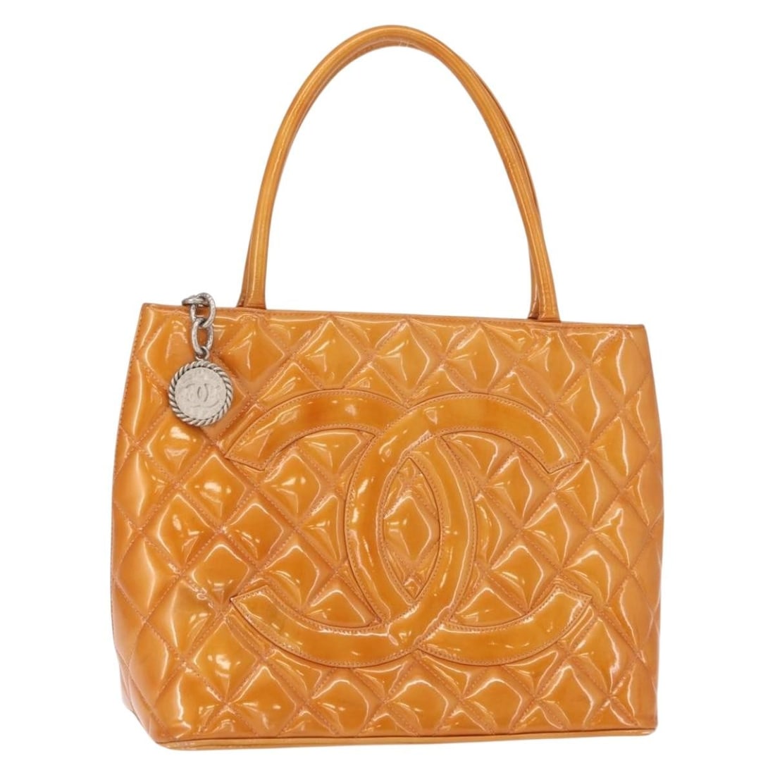 Beige Patent Leather Chanel Medallion Tote Bag 30cm by 24cm by 14cm: Beige Patent Leather Chanel Medallion Tote Bag 30cm by 24cm by 14cm This Chanel Medallion Tote in beige patent leather features a quilted design and is crafted in France. Designed for women, it offers