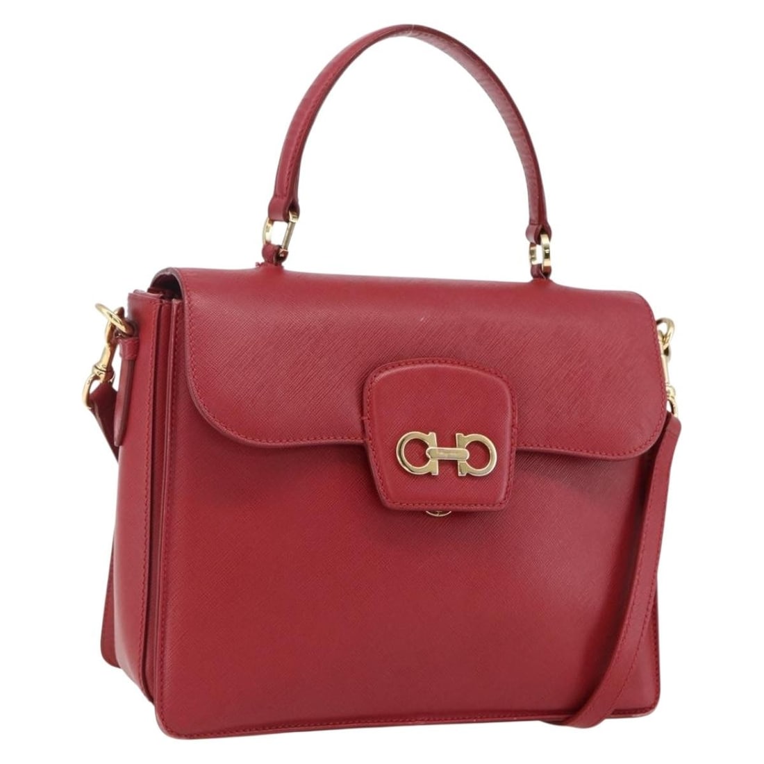 Red Leather Gancini Shoulder and Handbag by Salvatore Ferragamo with Strap: Red Leather Gancini Shoulder and Handbag by Salvatore Ferragamo with Strap This Salvatore Ferragamo Gancini handbag features a two-way design crafted from red leather with gold-tone accents. The bag i
