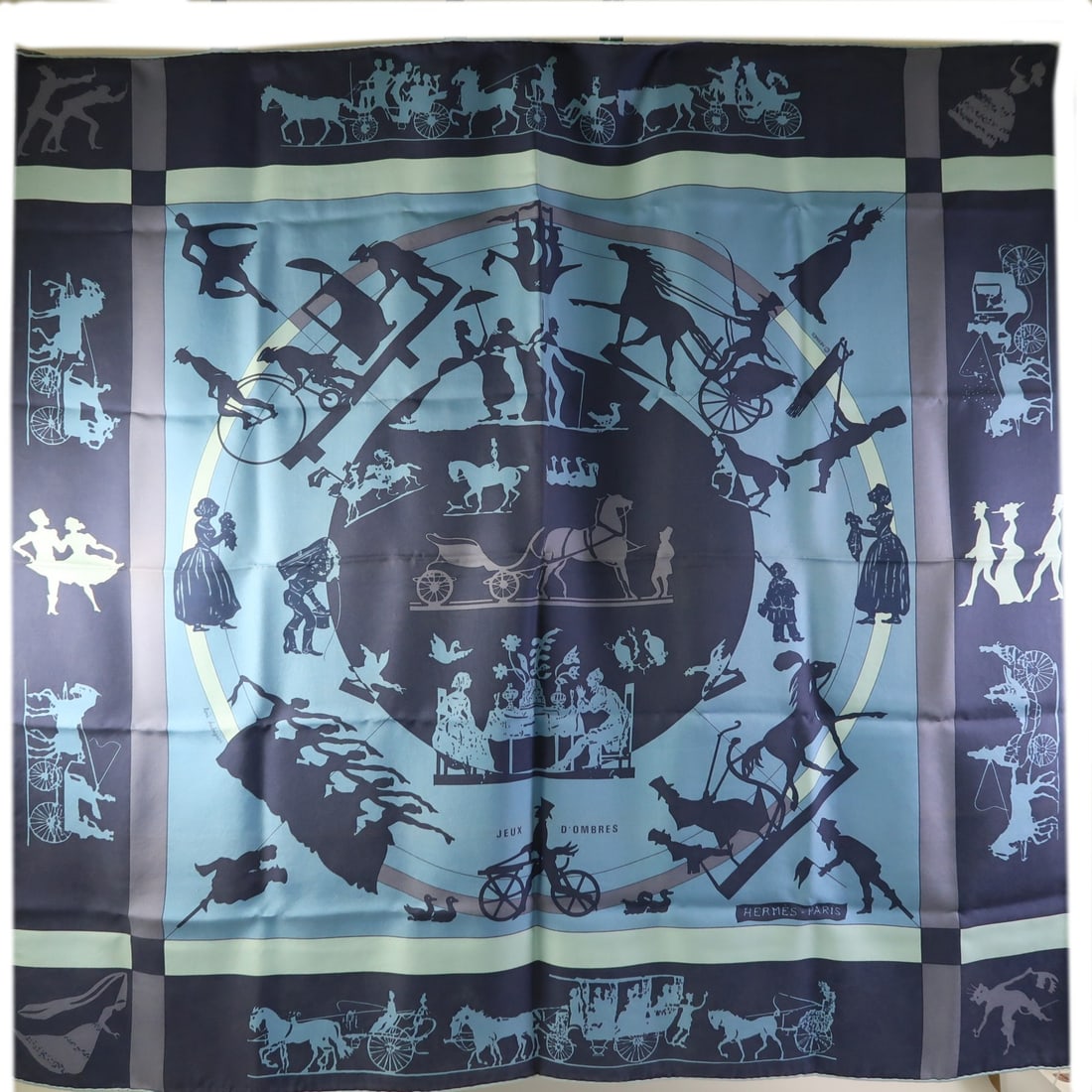 Blue Silk 90x90 cm Hermes Scarf Made in France: Blue Silk 90x90 cm Hermes Scarf Made in France This exquisite HERMES scarf is crafted from luxurious silk in a stunning blue hue. Measuring 90x90 cm, it showcases a classic design that adds a touch of