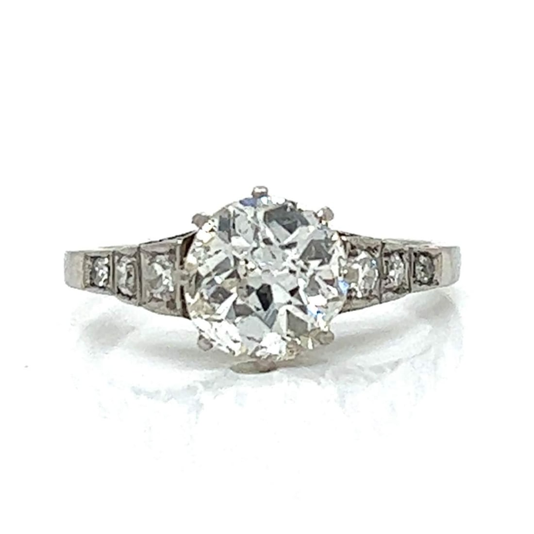 Art Deco Platinum Ring 1.49 Ct Diamond J I1 with 6 Diamonds: Art Deco Platinum Ring 1.49 Ct Diamond J I1 with 6 Diamonds This exquisite Art Deco ring showcases a stunning 1.49 Ct. European-cut diamond at its center, exhibiting a beautiful J color and I1 clarity