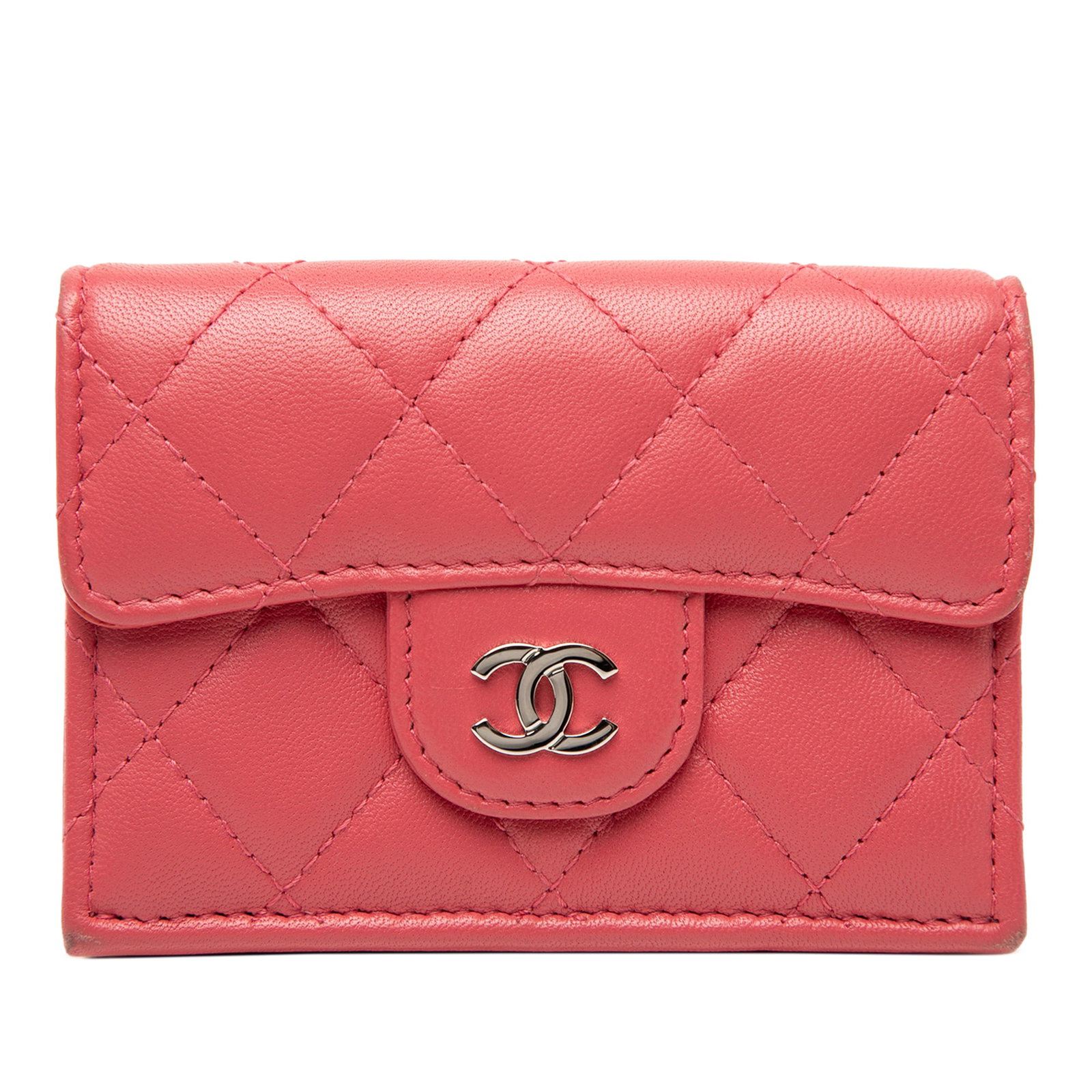 Chanel Pink Quilted Lambskin Leather Small Flap Wallet with Coin Pocket: Chanel Pink Quilted Lambskin Leather Small Flap Wallet with Coin Pocket This compact wallet features a quilted lambskin leather exterior in pink, a front flap coin compartment, a snap button closure, 