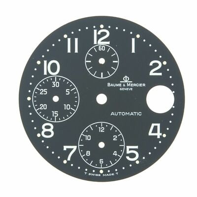 Baume Mercier Geneve Black 29 mm Arabic Dial Watch Face: Baume Mercier Geneve Black 29 mm Arabic Dial Watch Face This is a pre-owned Baume & Mercier Geneve watch dial, featuring a 29 mm diameter and Arabic numerals in a black color scheme. The dial does not