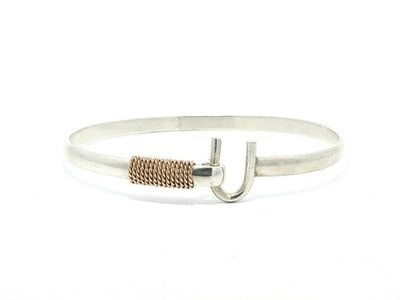 Sterling Silver Bypass Cuff Bangle with 14k Rose Gold Rope Wrap: Sterling Silver Bypass Cuff Bangle with 14k Rose Gold Rope Wrap This bypass cuff bangle bracelet features a sophisticated design crafted from sterling silver with a twisted rope wrap accent in 14k ros