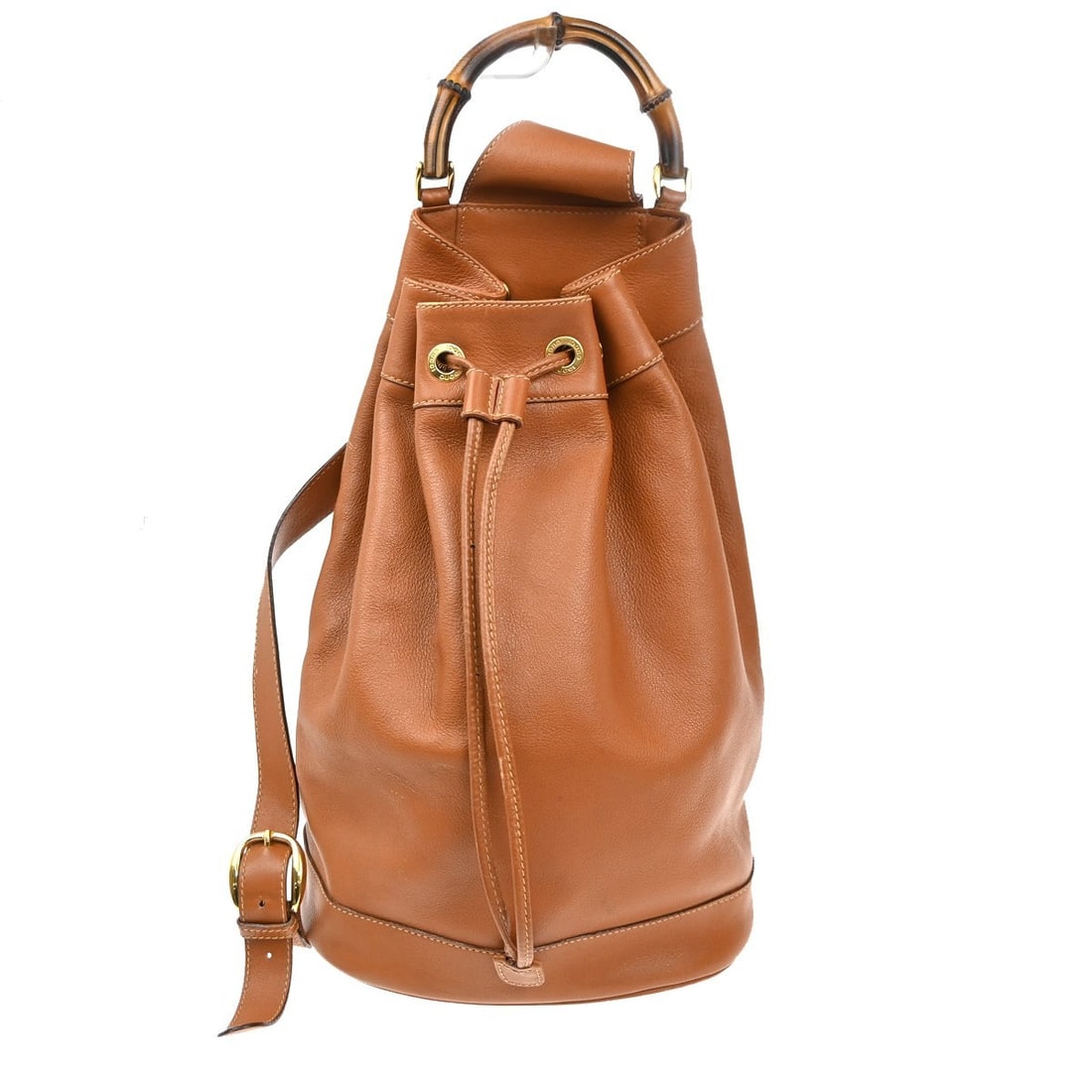 Brown Leather Gucci Bamboo Sling Vintage Backpack for Women: Brown Leather Gucci Bamboo Sling Vintage Backpack for Women This Gucci Vintage Bamboo Sling Backpack is crafted from brown leather and designed specifically for women. The backpack features signature 
