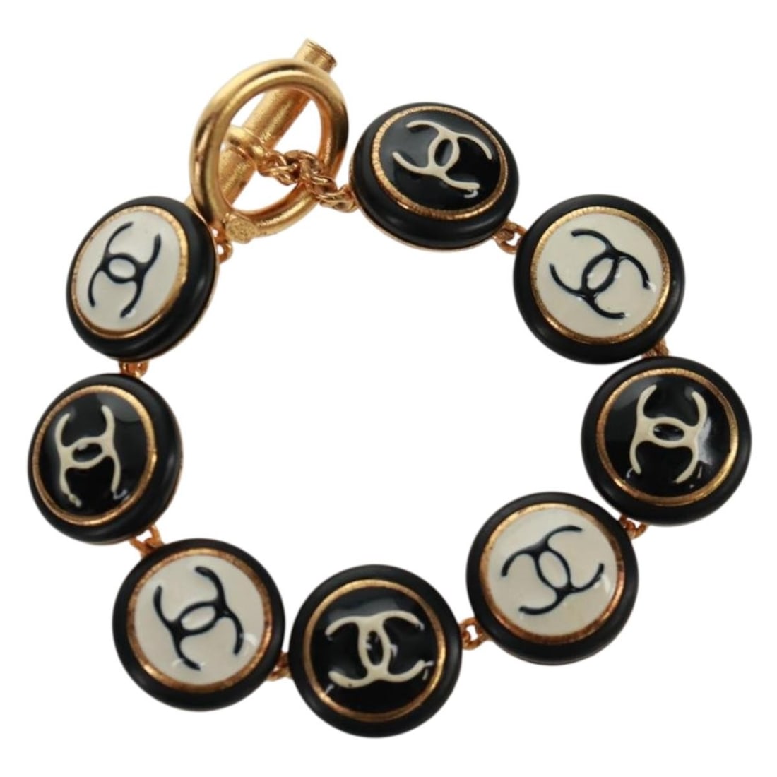 Black Metal Bracelet by CHANEL with CC Logo and Original Packaging: Black Metal Bracelet by CHANEL with CC Logo and Original Packaging This CHANEL bracelet features a sleek black metal design and showcases the iconic CC logo. Crafted in France, it offers a stylish acc