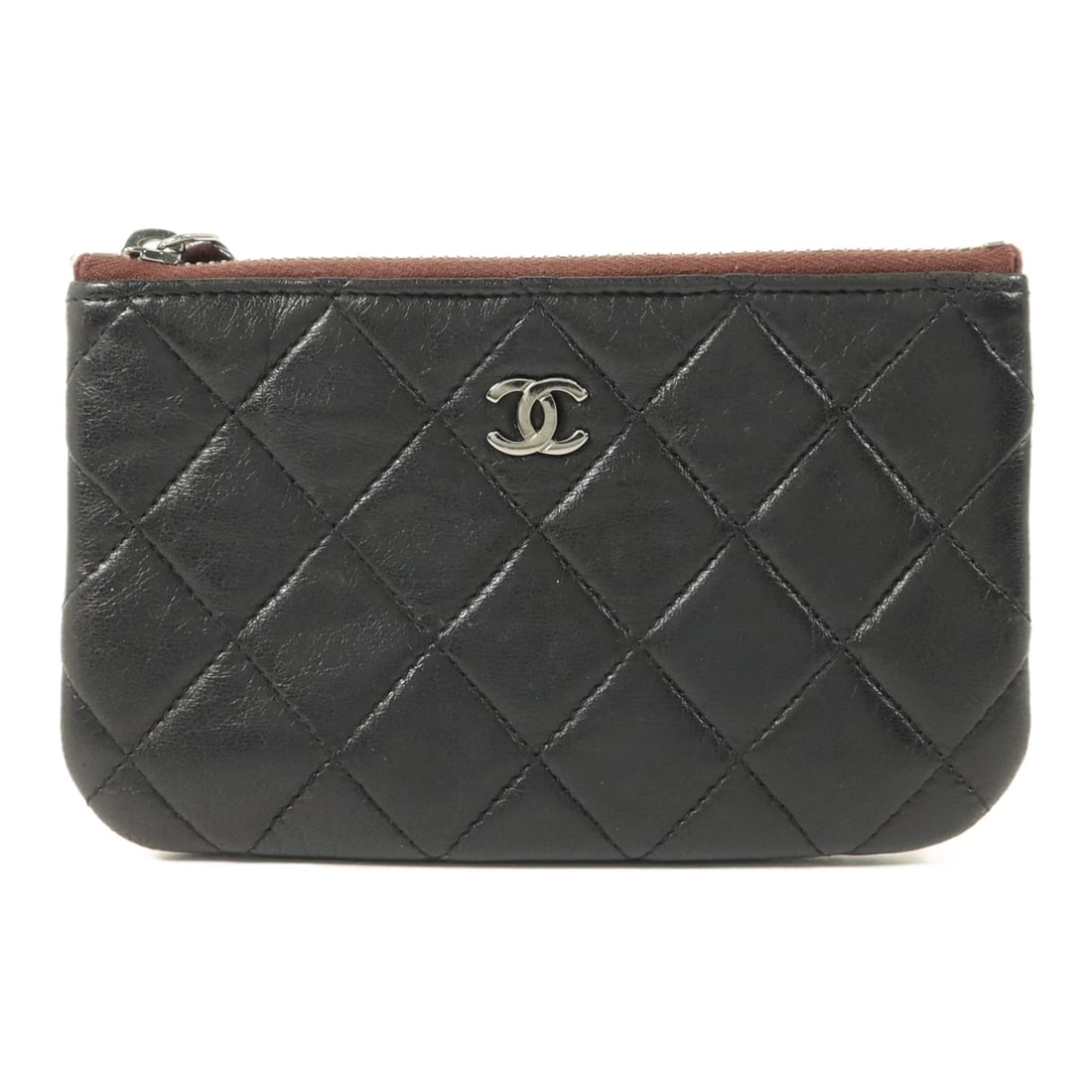 CHANEL Mini Zip Pouch Black Lambskin Leather CC SHW: CHANEL Mini Zip Pouch Black Lambskin Leather CC SHW This CHANEL mini zip pouch is crafted from luxurious black lambskin leather and features the signature CC logo with silver-tone hardware. Designed f