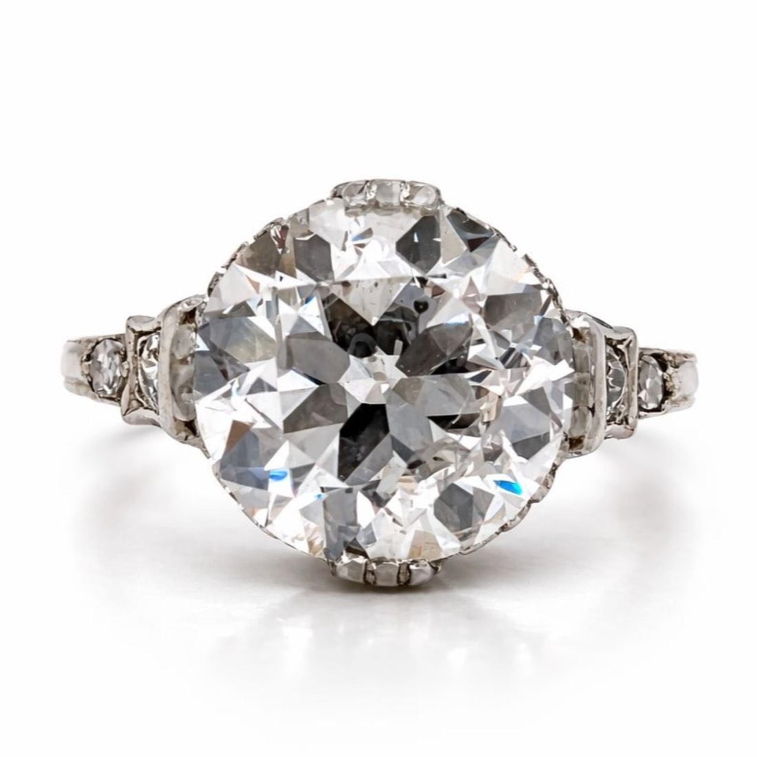 Platinum Art Deco Engagement Ring with 4.27 Ct Old European Diamond: Platinum Art Deco Engagement Ring with 4.27 Ct Old European Diamond This Art Deco platinum engagement ring features a 4.27 carat old European-cut diamond with G color and SI2 clarity as the centerpiec