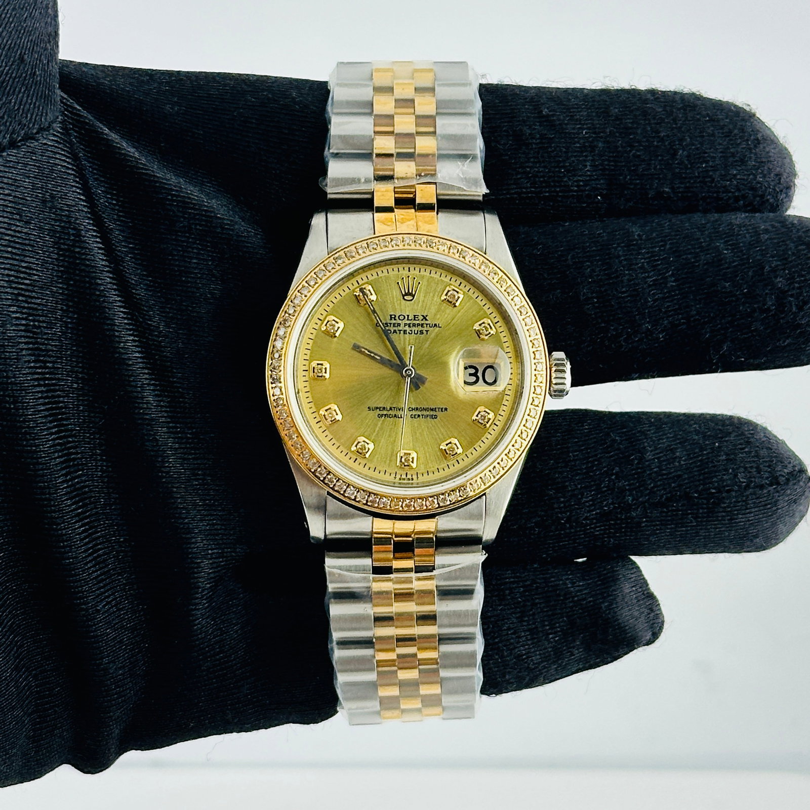 Aftermarket Champagne Diamond Dial for Rolex Datejust Reference 1601: Aftermarket Champagne Diamond Dial for Rolex Datejust Reference 1601 This Rolex Datejust features an aftermarket champagne diamond dial and an aftermarket bracelet. The bezel is aftermarket pave plate