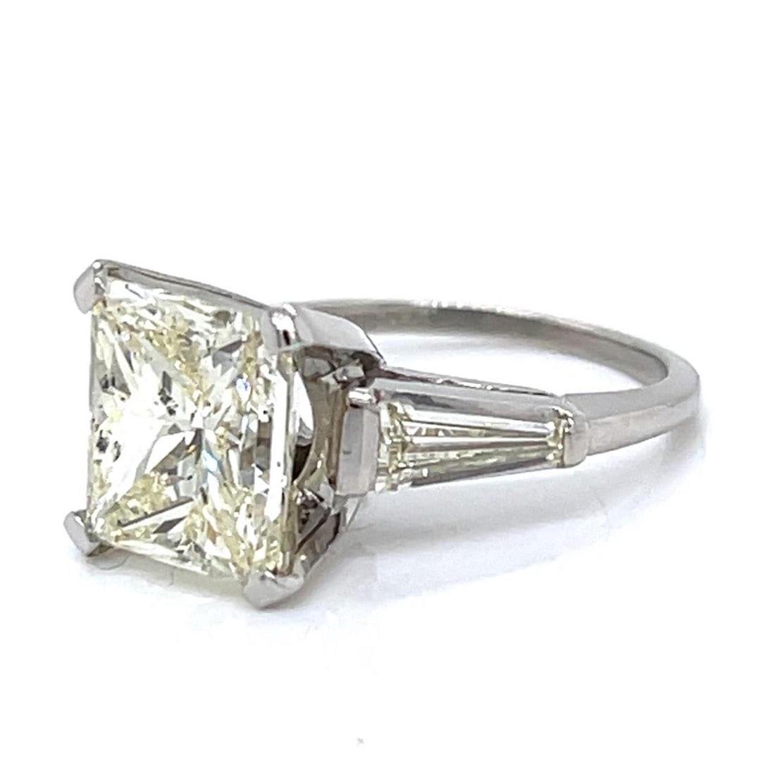 5.07 Ct Princess-Cut Diamond Ring in Platinum: 5.07 Ct Princess-Cut Diamond Ring in Platinum This exquisite platinum ring showcases a stunning 5.07 ct. princess-cut diamond, graded M color and Si3 clarity. Weighing 8.1 grams, this elegant piece is