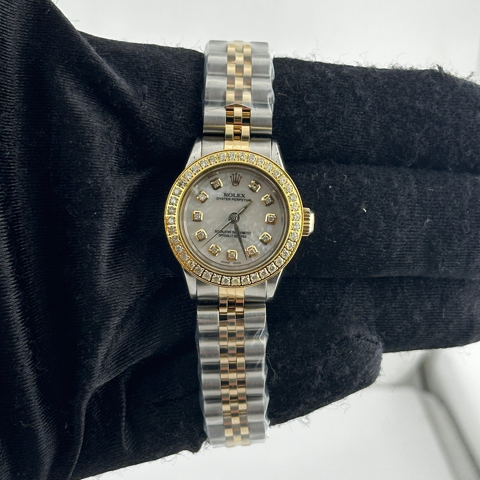 Ladies Oyster Perpetual Ref 6623 White MOP Diamond Dial Jubilee Bracelet: Ladies Oyster Perpetual Ref 6623 White MOP Diamond Dial Jubilee Bracelet This ladies Rolex Oyster Perpetual features an aftermarket white mother-of-pearl diamond dial and an aftermarket Jubilee bracel